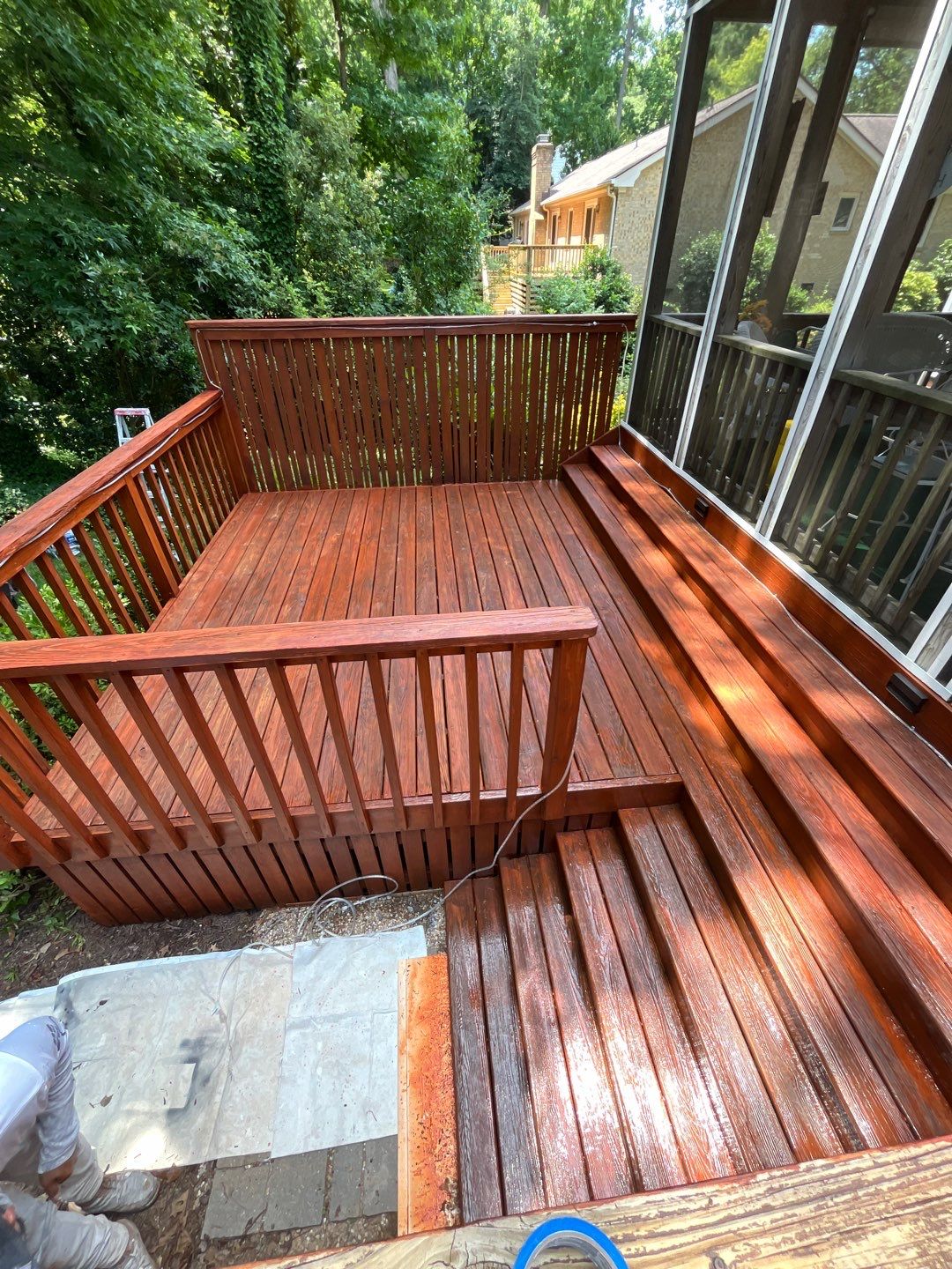 Triple deck re-staining by AKK Painting LLC