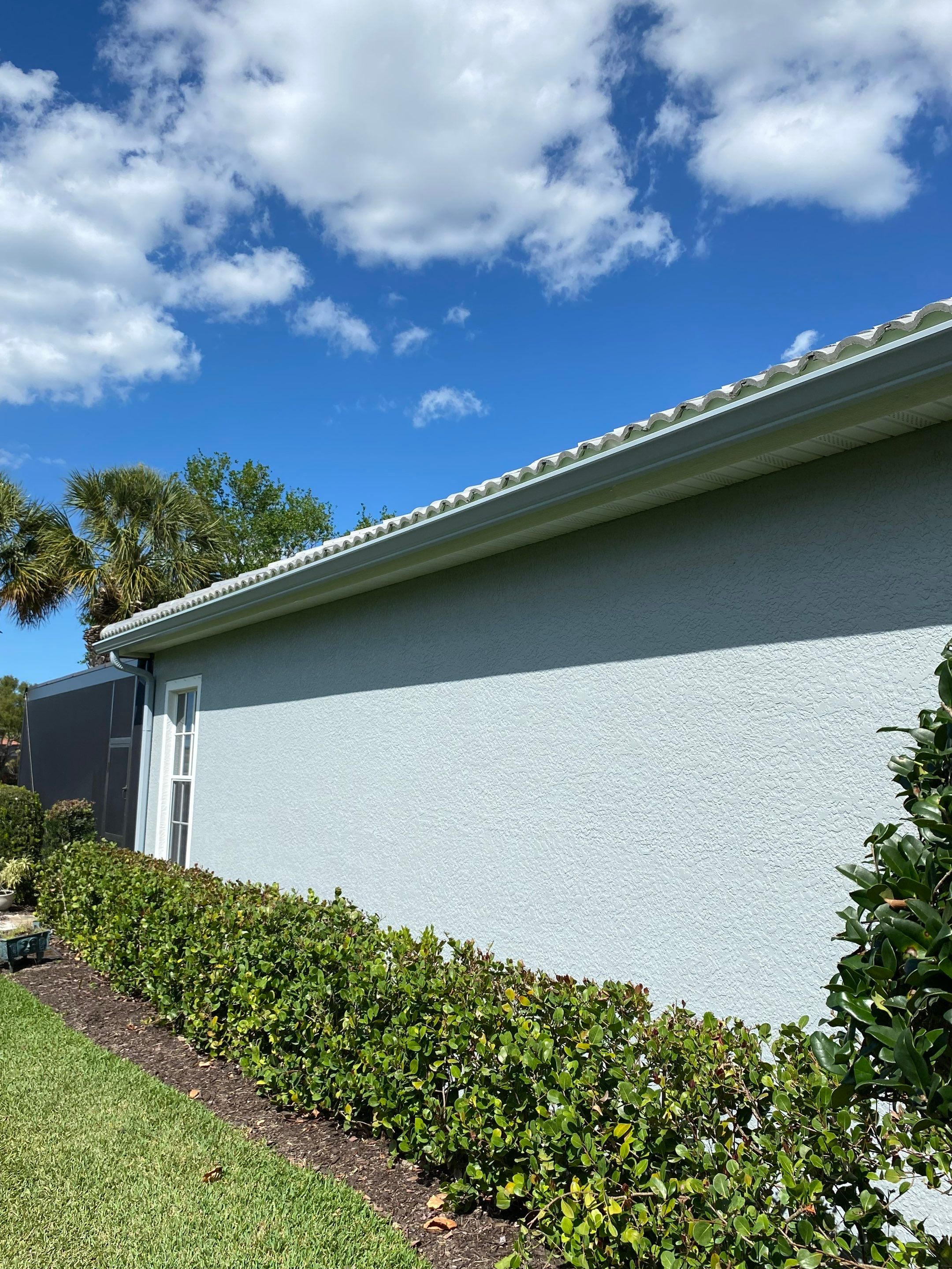 6-inch K-style Seamless Gutters and Splash Guard in Grey Color in Naples FL by Gutter Professors