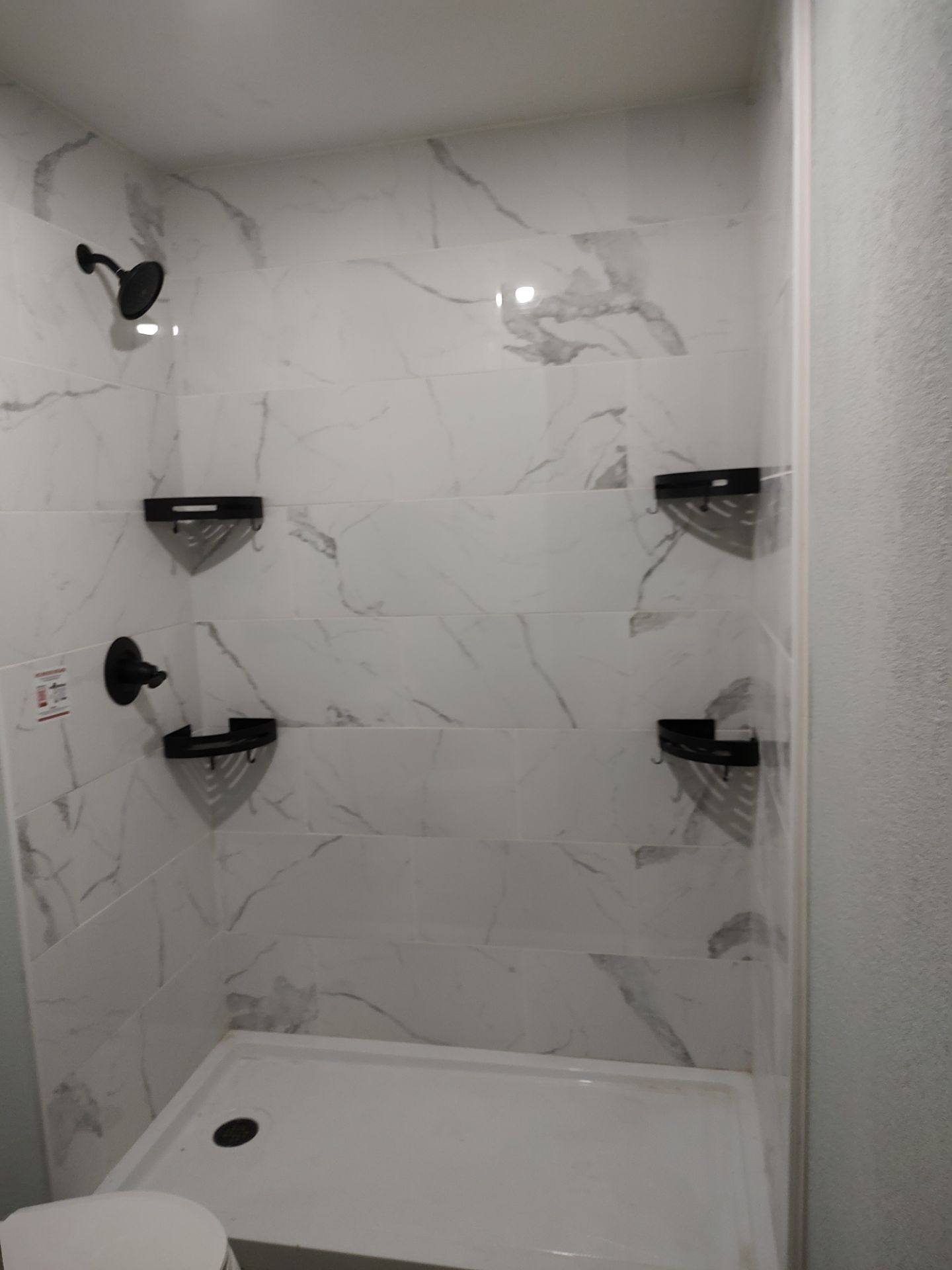 Bathroom remodel w/shower upgrade by In & Out Construction & Remodeling, LLC