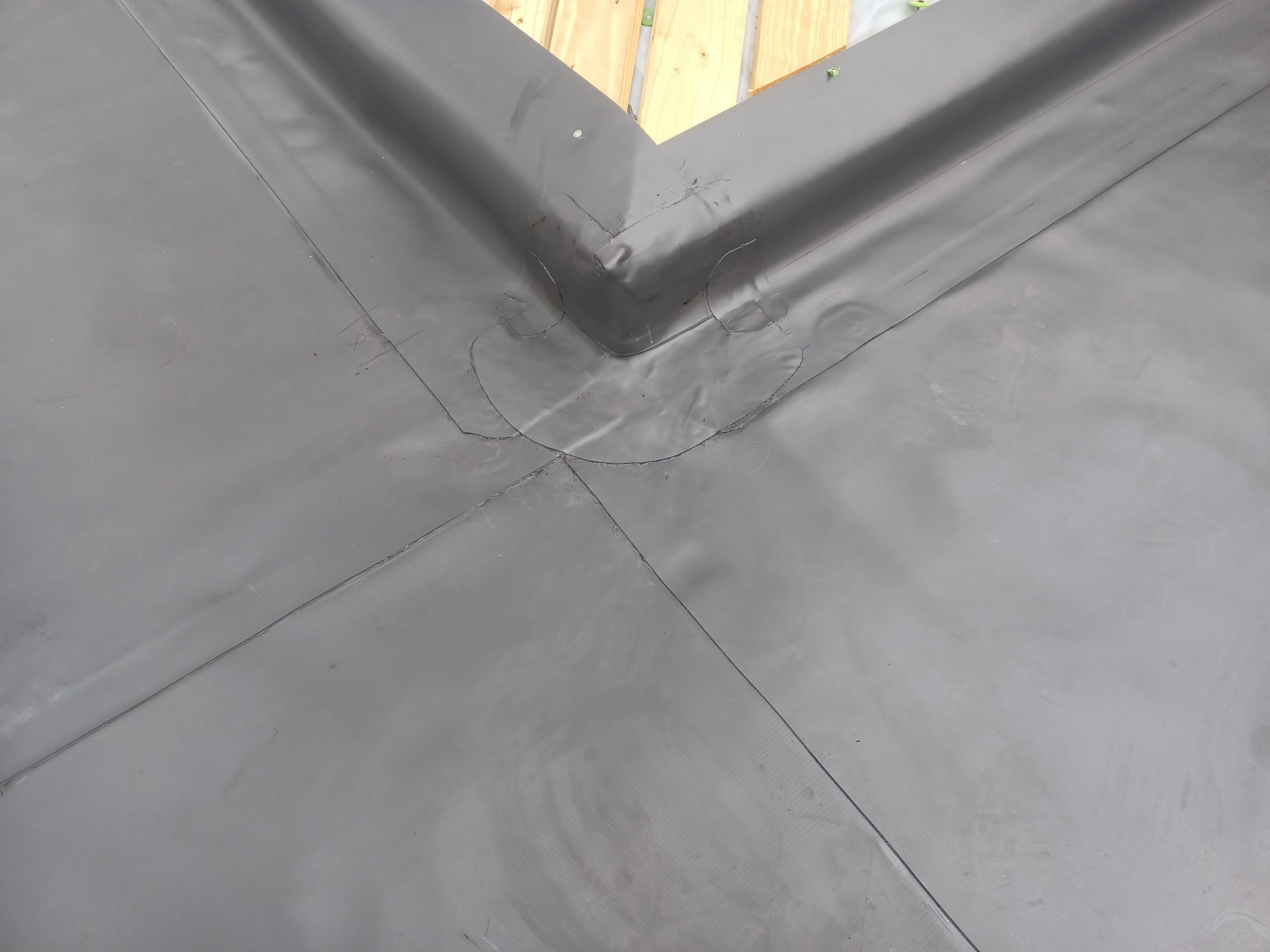 Residential Roofing Installation using PVC membrane and 24 gauge Standing Seam Metal by Hostetler Roofing