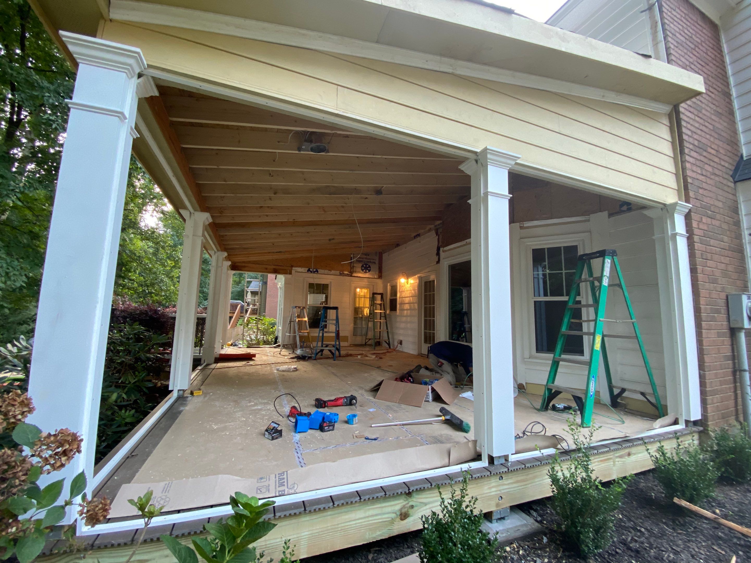 Custom Screened Porch with Beadboard Ceiling and Composite Decking by Swift Home Renovations