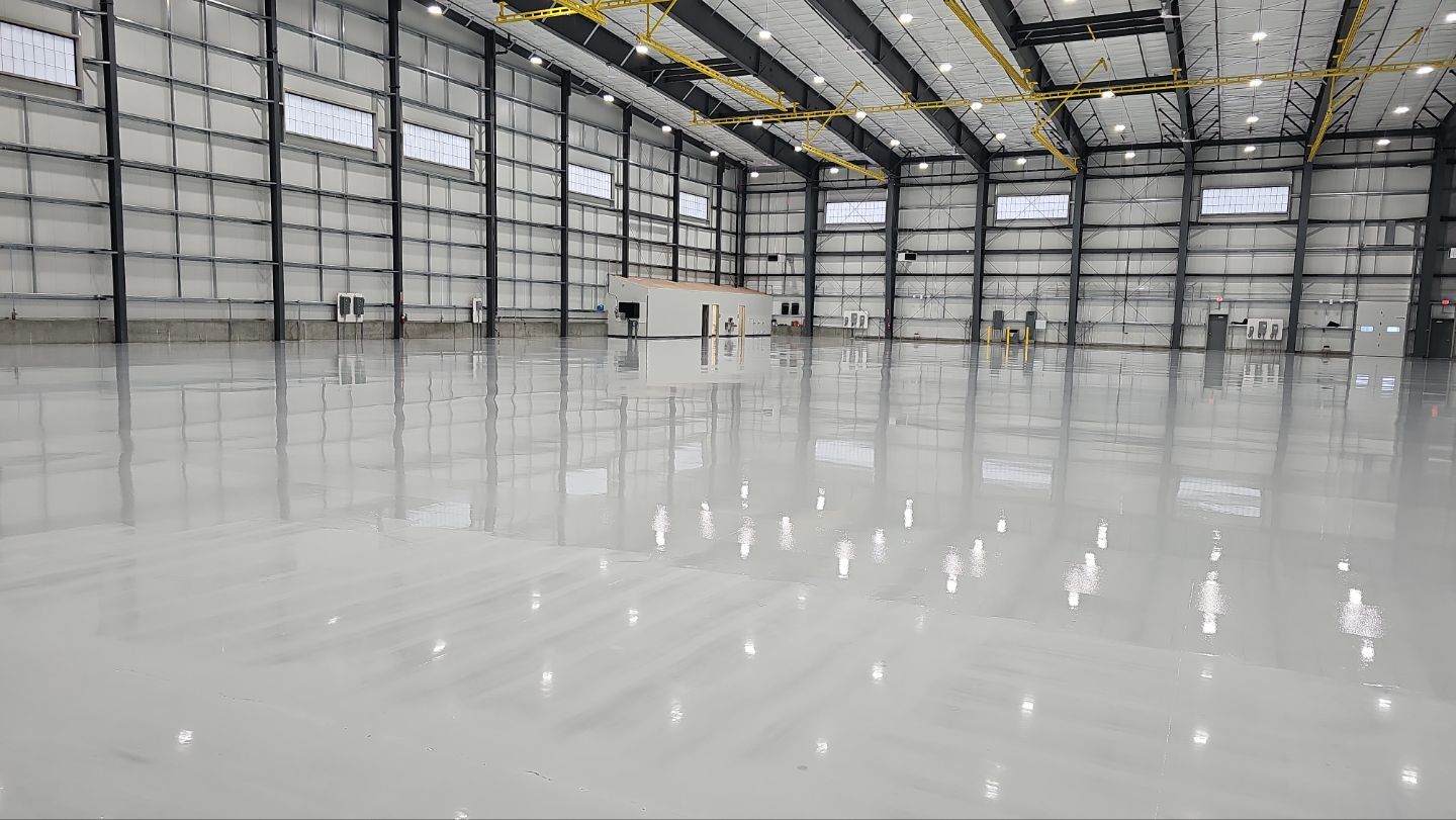 Airplane Hanger using Light Grey Commercial Penntek Epoxy by Croc Coatings, LLC