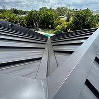 24ga 1.5" Mechanical Seam Matte Black by Total Roofing System The Metal Roof Experts