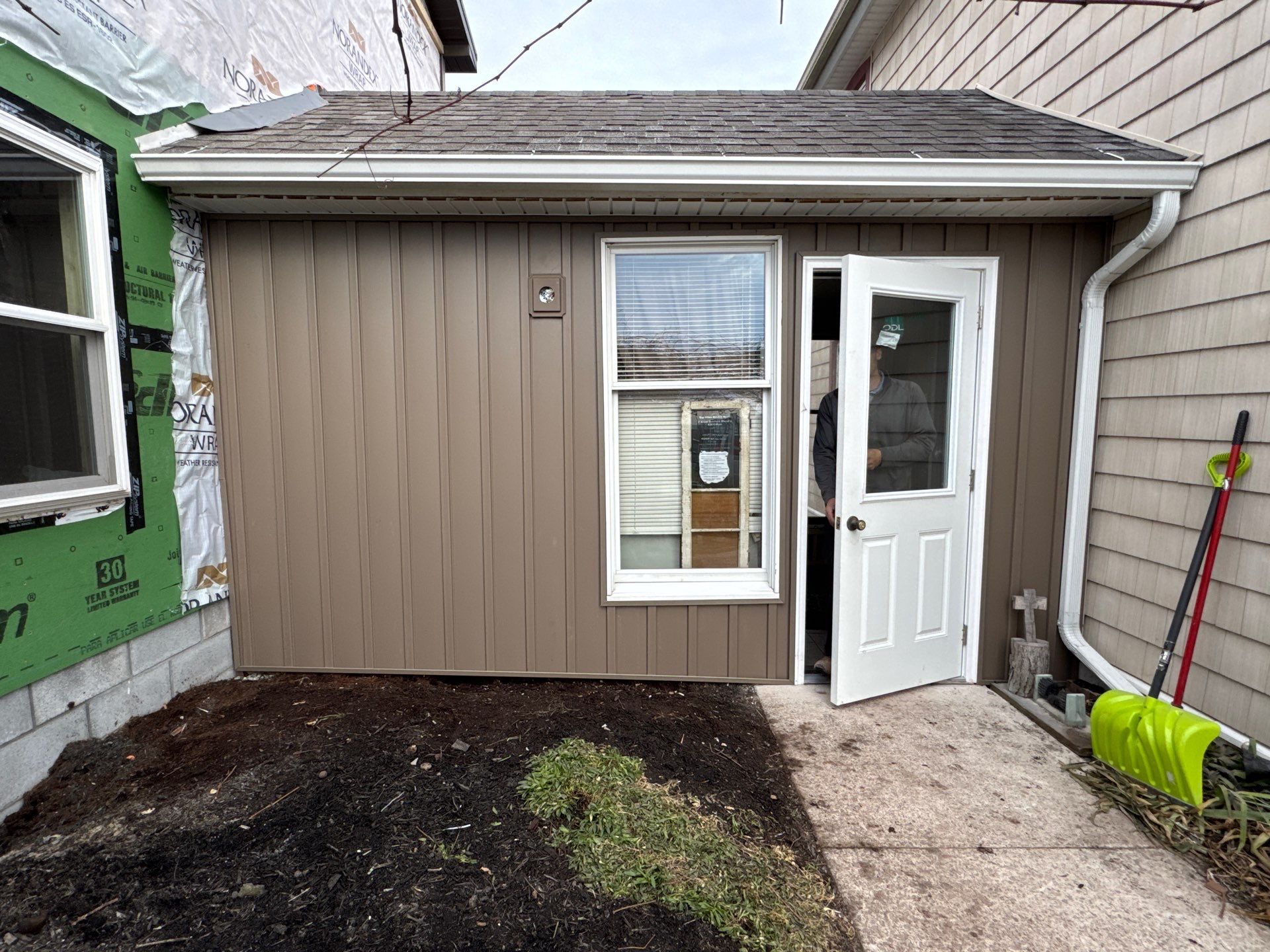 Multi-Story Residential Addition Featuring Textured Metal Siding in Millersburg by Esh Builders