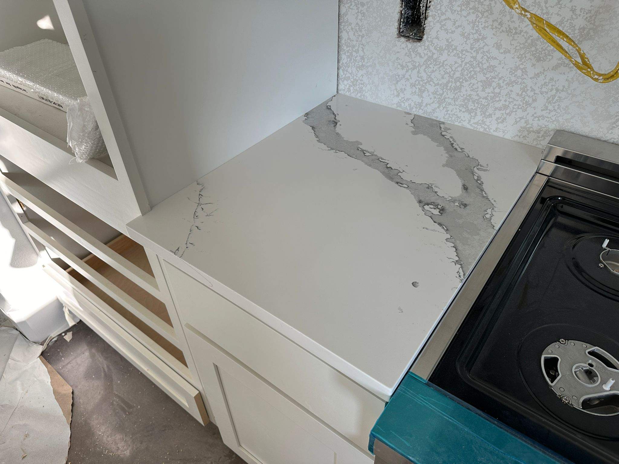 Kitchen and Bathroom Countertop Upgrades Featuring Gray Veined Quartz by Mena stone surfaces