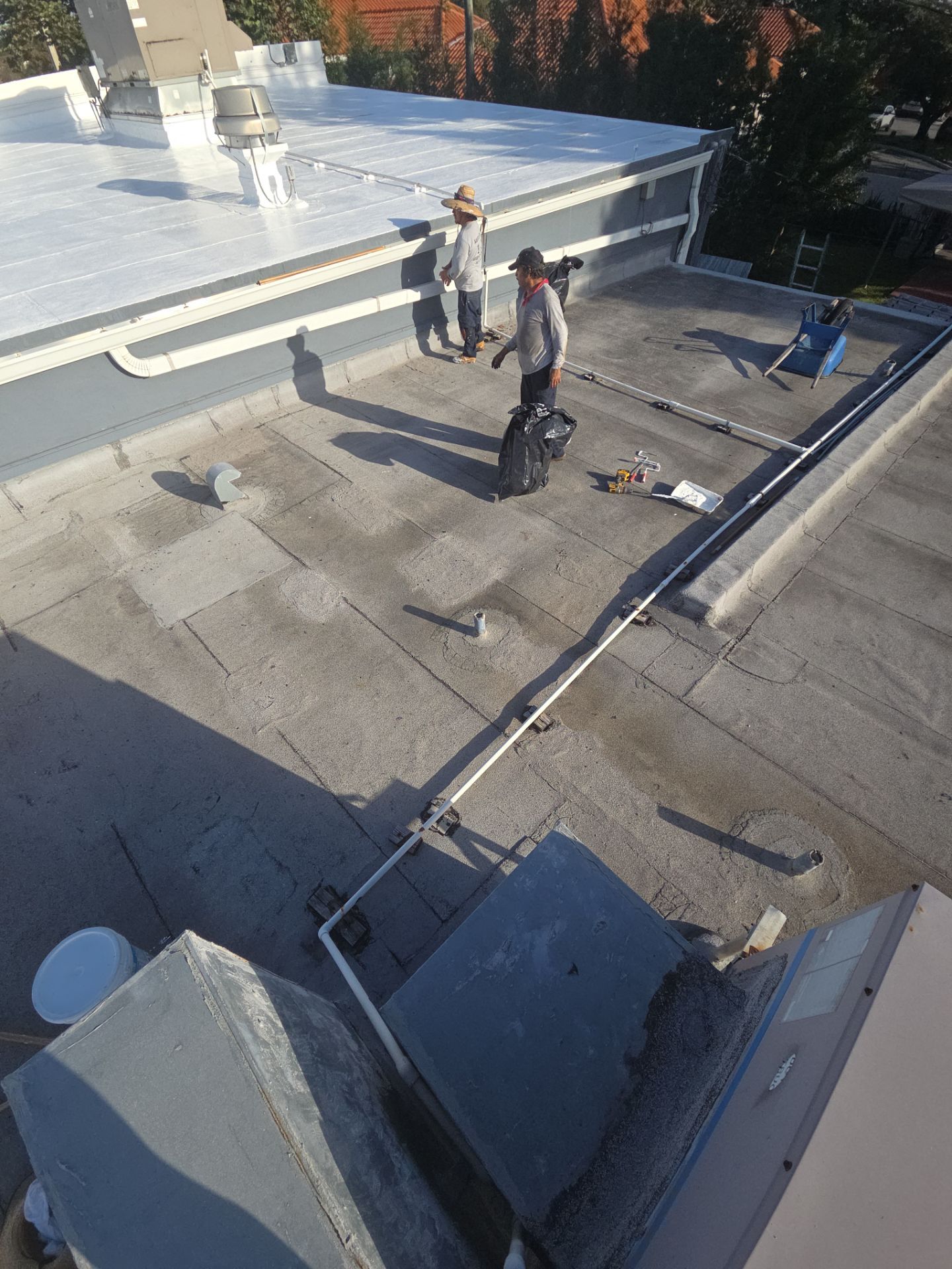 Commercial Flat Roof Restoration Using Silicone Coating in Hallandale Beach by Aastro Roofing