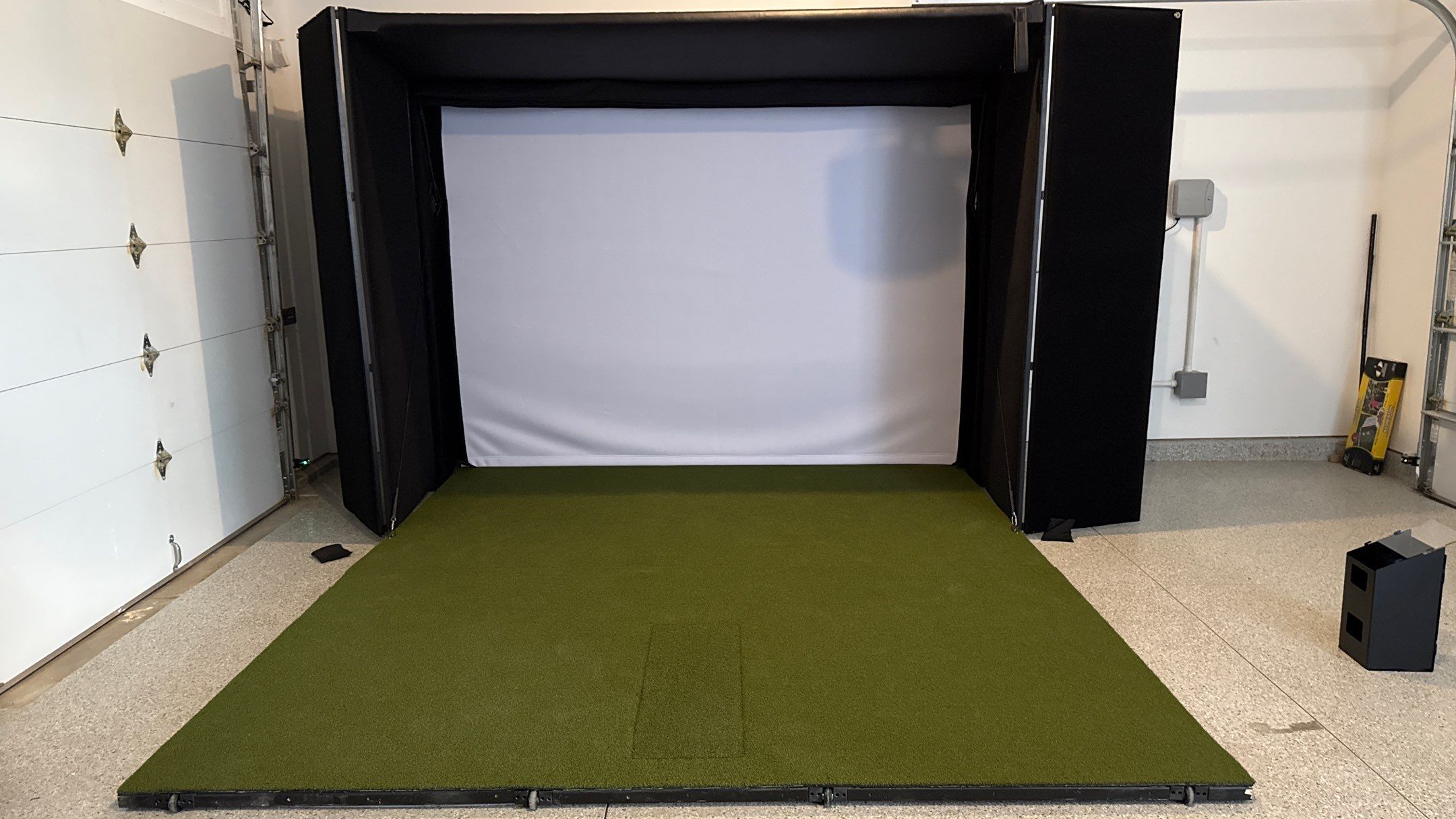 Ben Took It To The Next Level With a Golf Simulator by Banner Garage