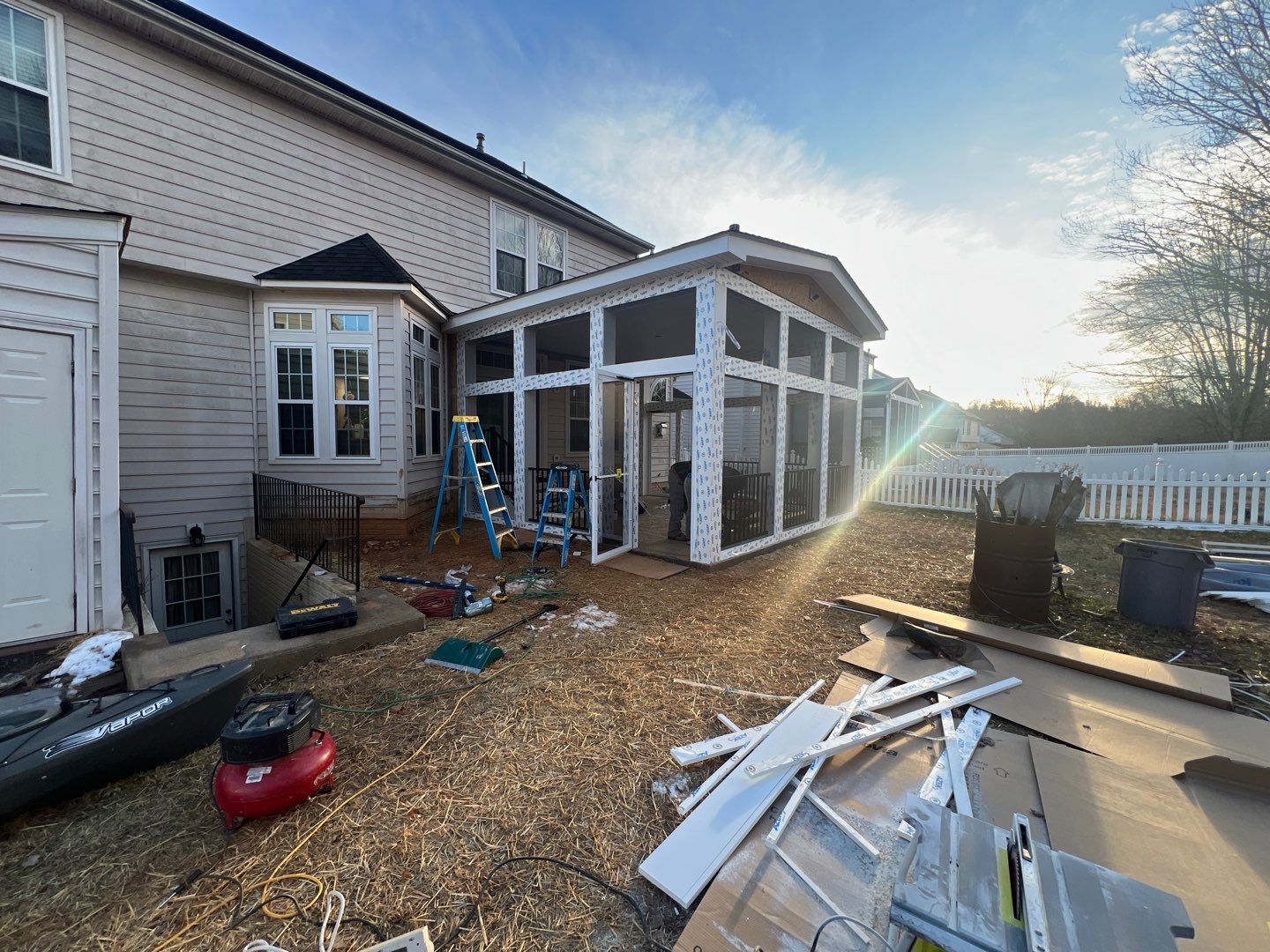 Custom Screened-In Porch with Stamped Concrete Patio in Warrenton by Jakari Restoration & Construction LLC