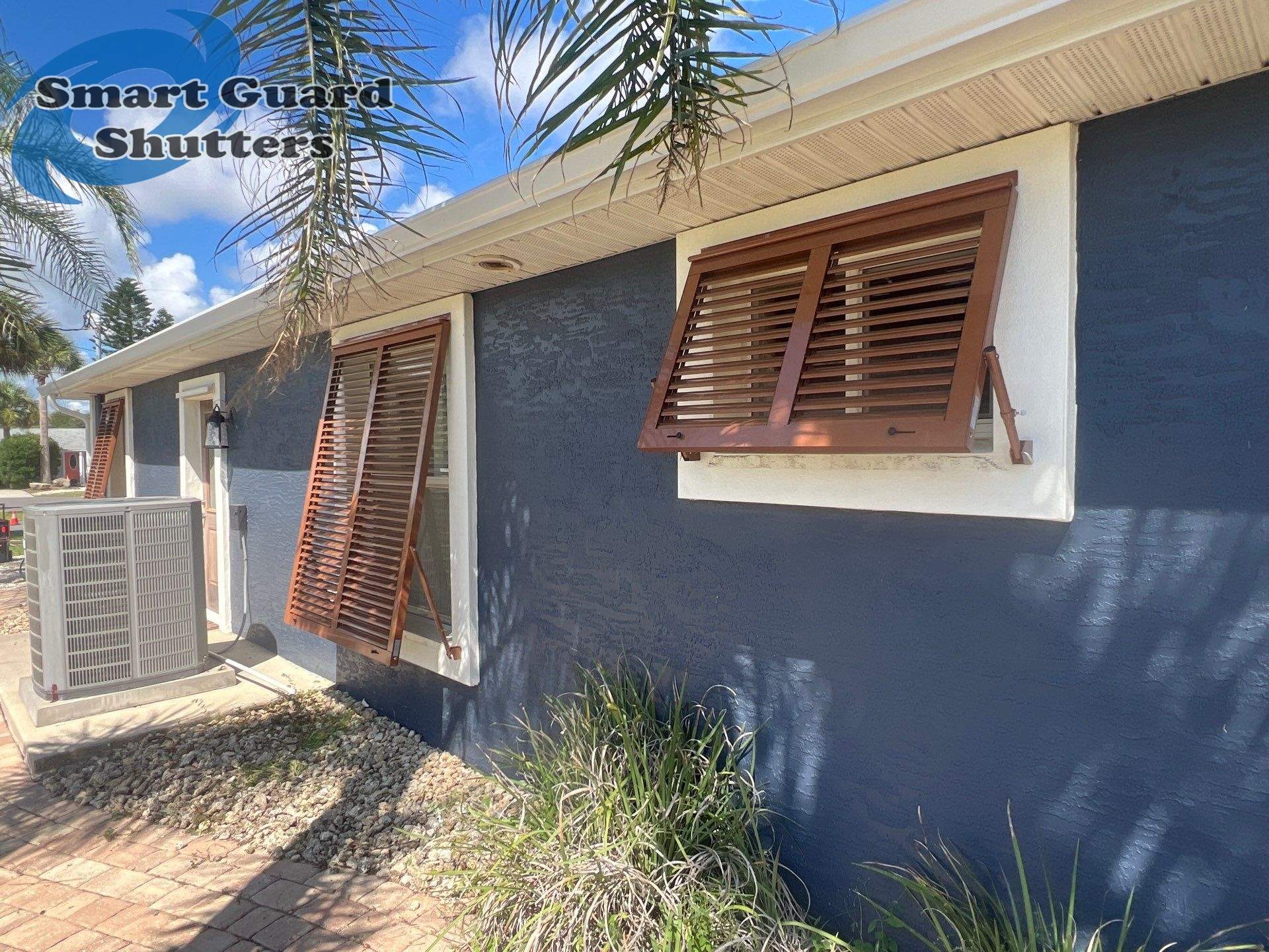 Impact Rated Bahama Shutters in Beige Brown by Smart Guard Shutters