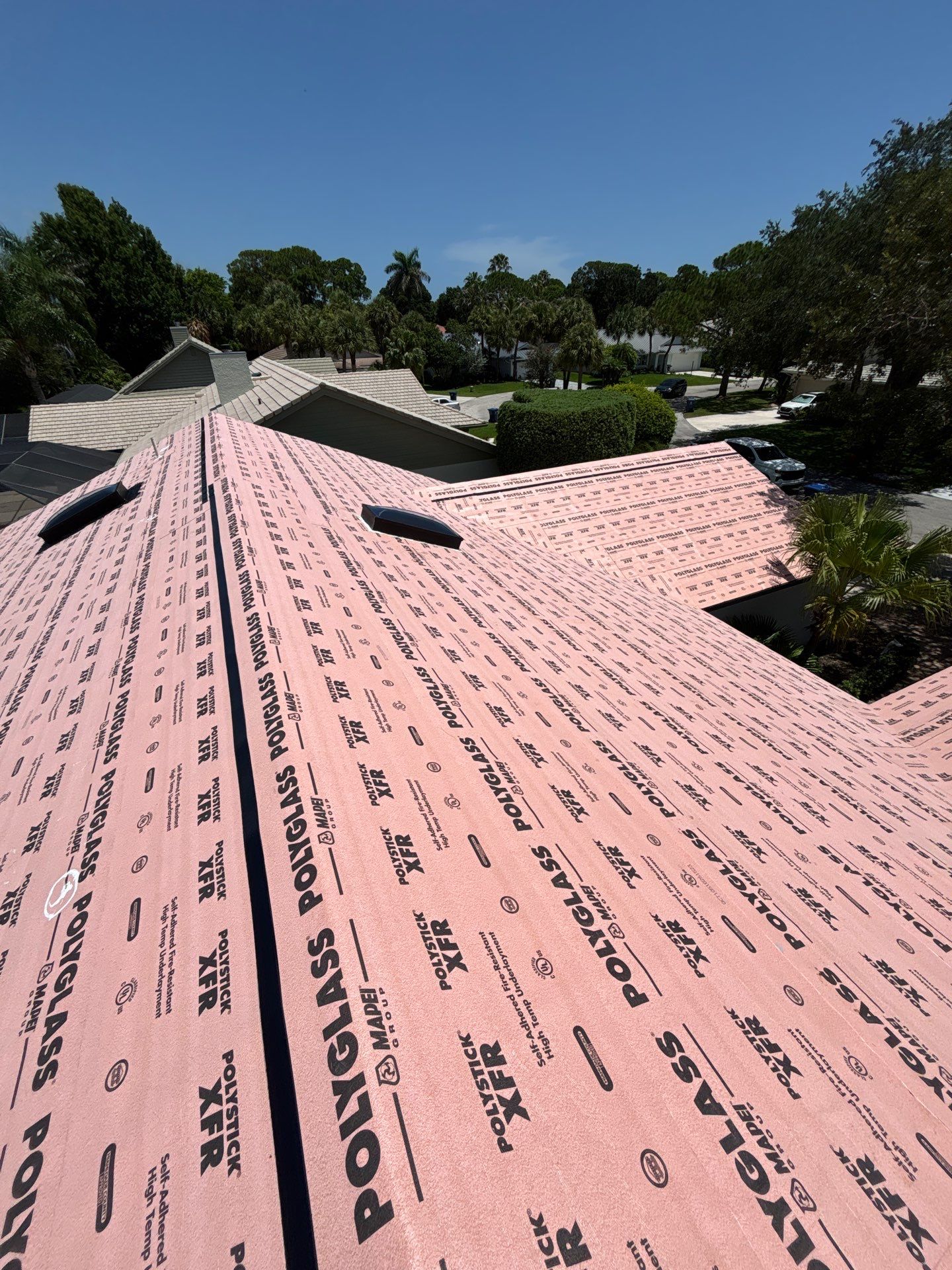 Standing Seam Metal Charcoal Grey Roof Replacement and Skylight Installation in Jupiter by Art's Roofing & Construction