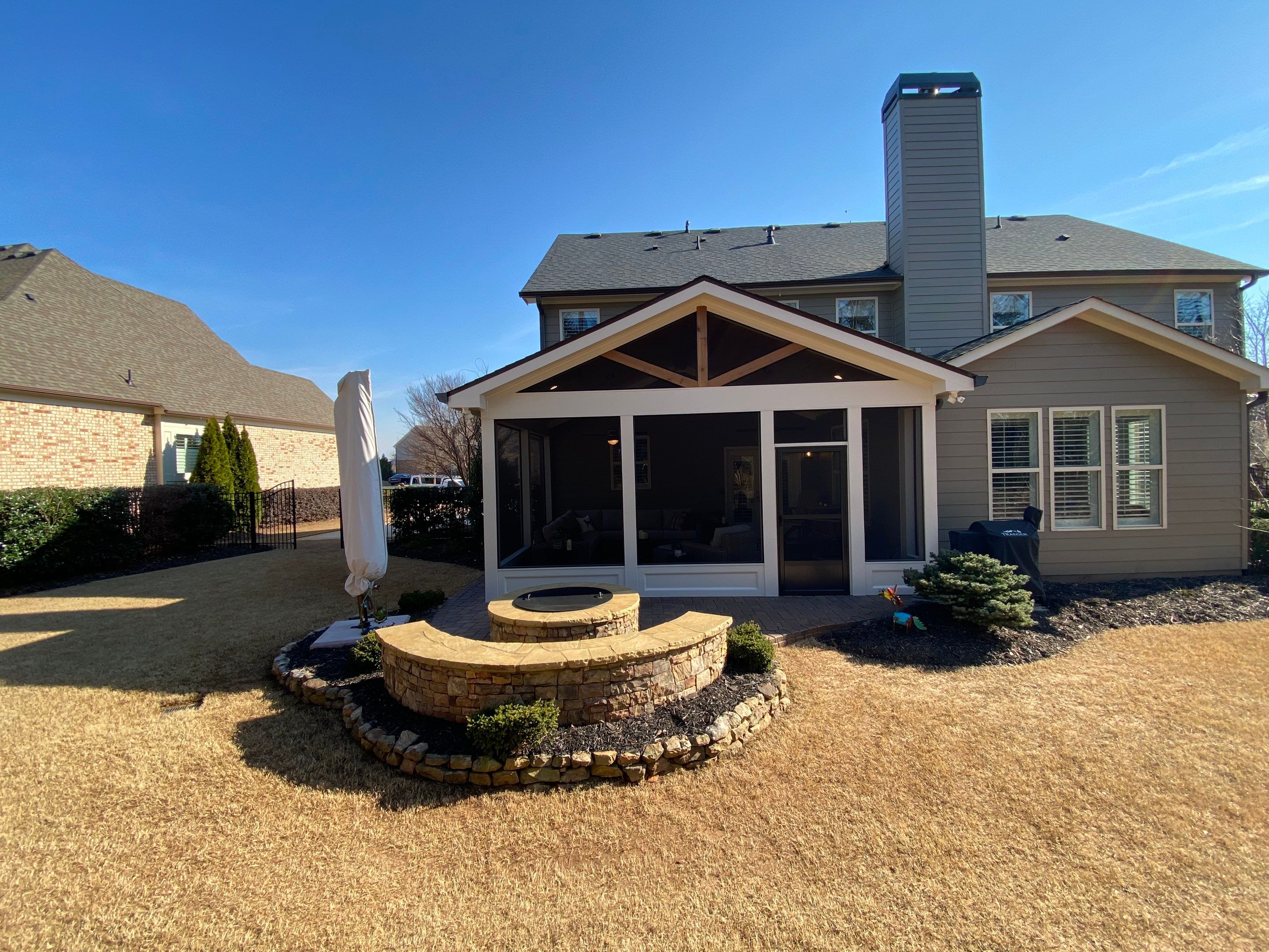 Custom Screened Porch Addition with Vaulted Wood Ceilings in Woodstock by Swift Home Renovations