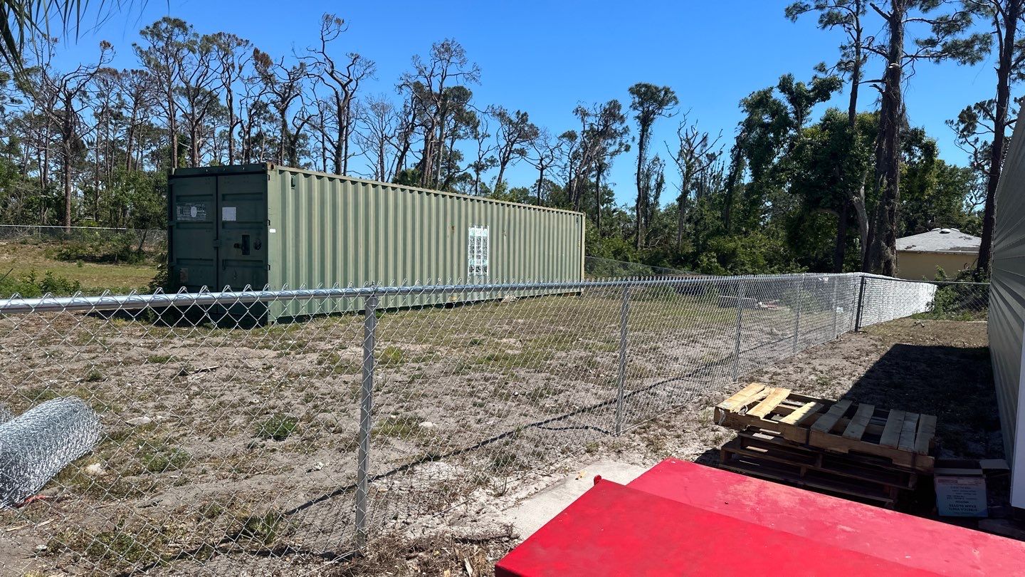 Commercial Chainlink and Vinyl Fence With Aluminum Framed Gates On Dumpster Enclosure by Asap fence and gates, LLC