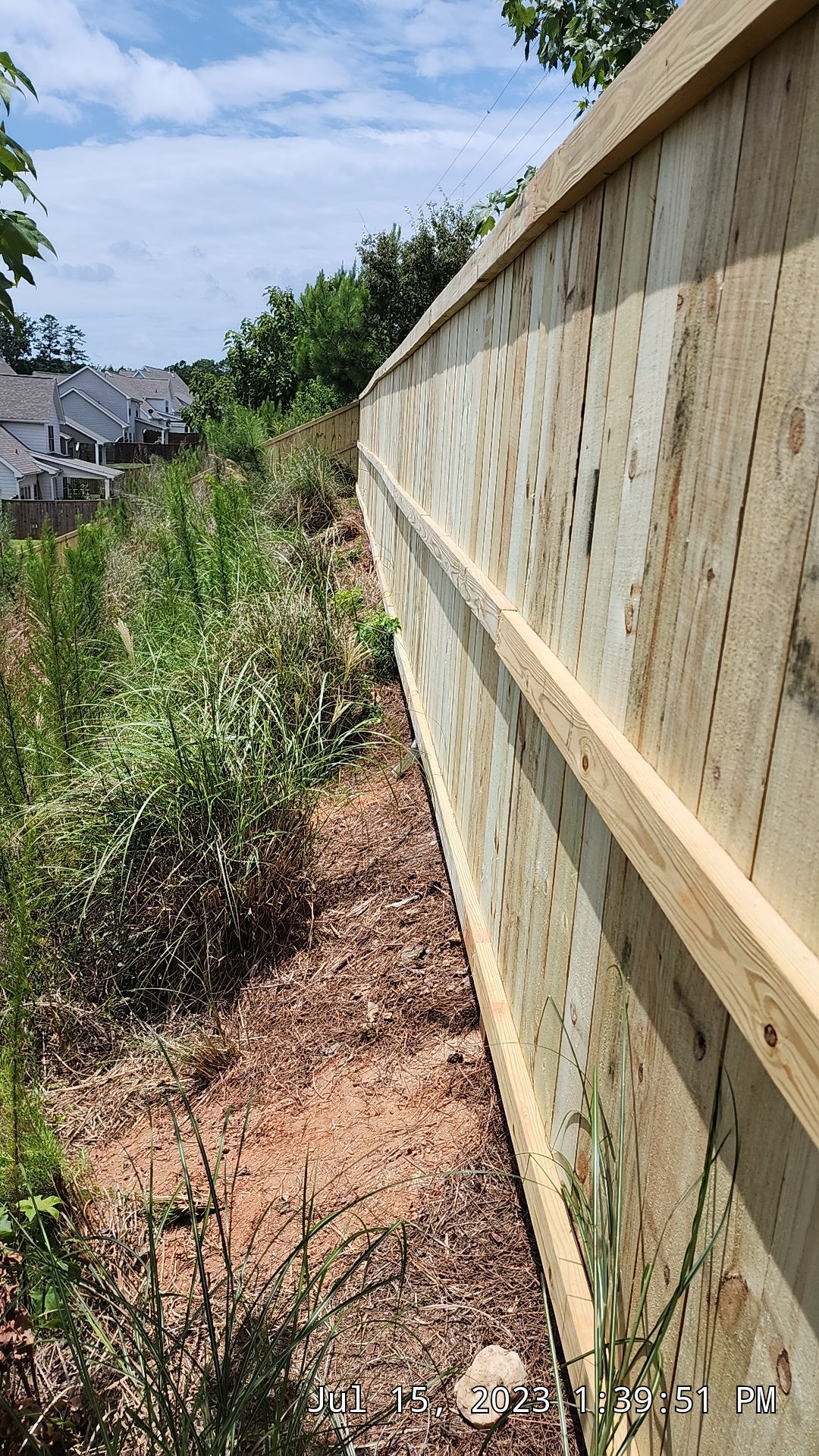 Fence Installation of Capped Wood Privacy by Titans of Timber Fence & Stain