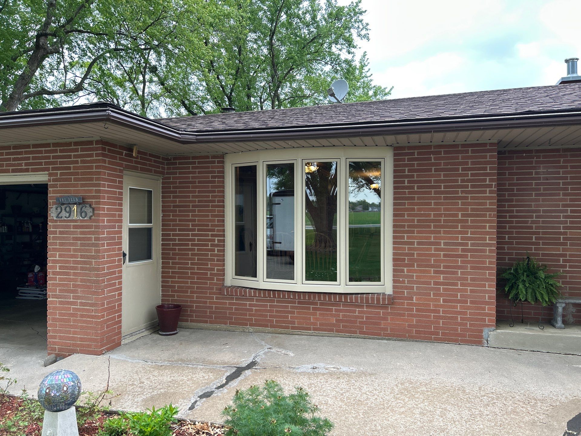 Bow window replacment using Pella Lifestyle wood/Aluminum window by United Windows and Siding LLC