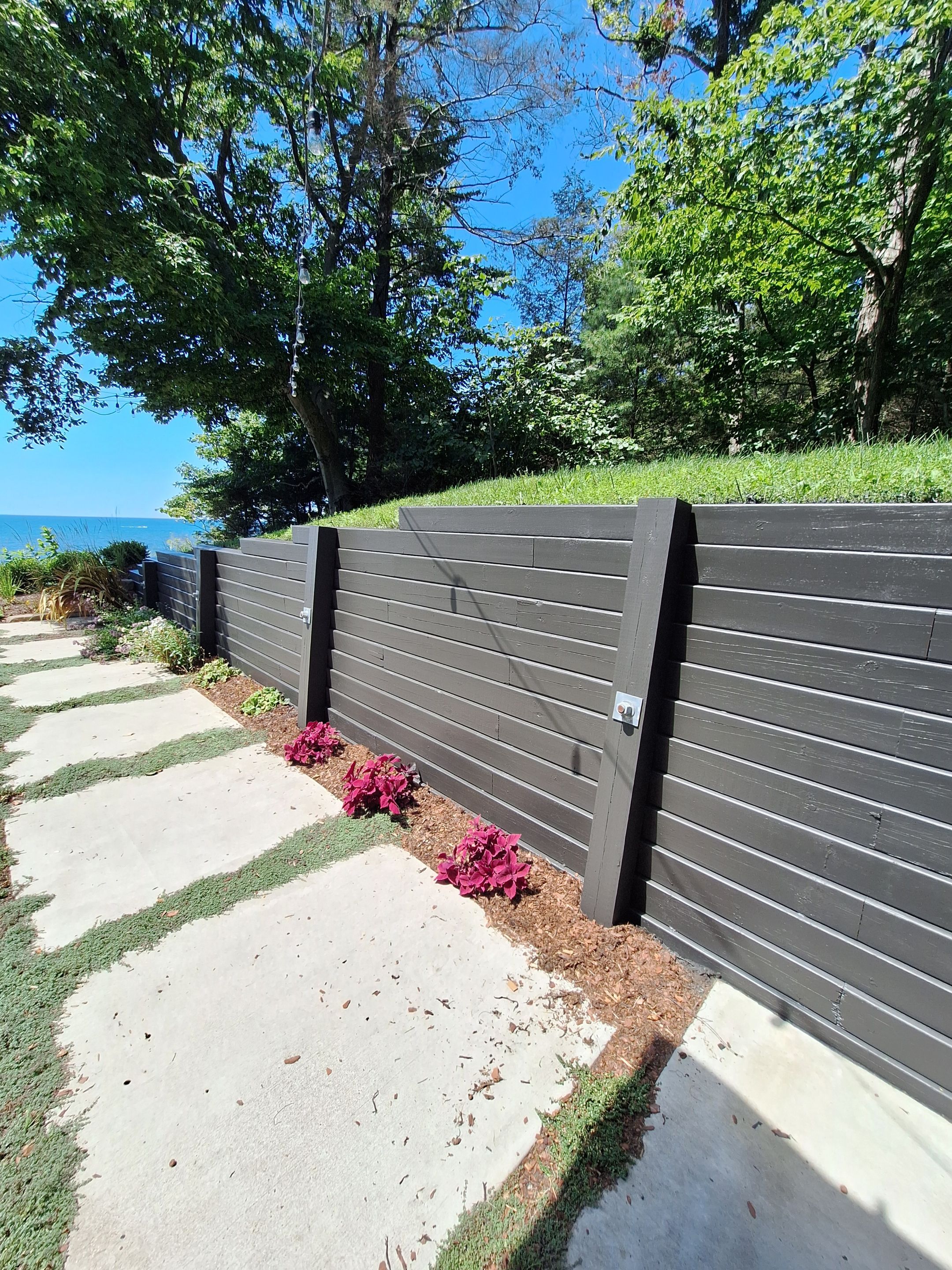 Exterior Retaining Wall Painting | Grand Haven, Michigan by Gordon Painting