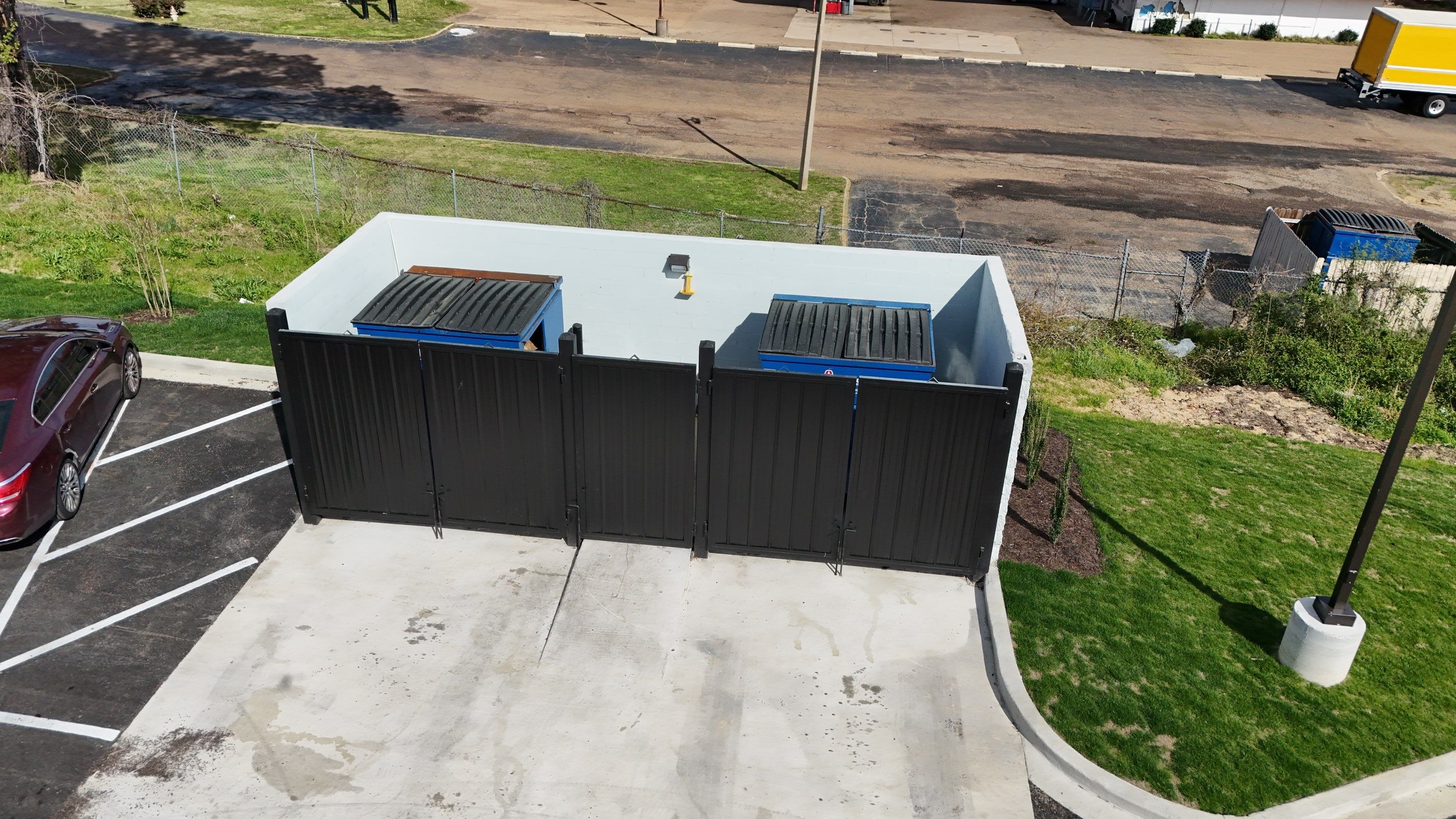 6' Black Chain Link Fence & Concrete Block Dumpster Enclosure by Roberson Construction LLC