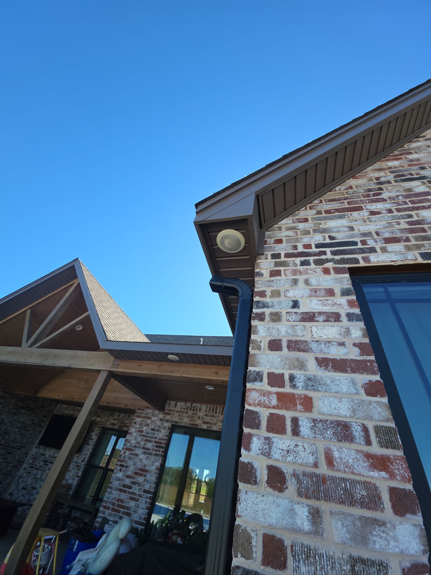 Fascia and door frames wrapped with PVC coil & soffit installation by In & Out Construction & Remodeling, LLC