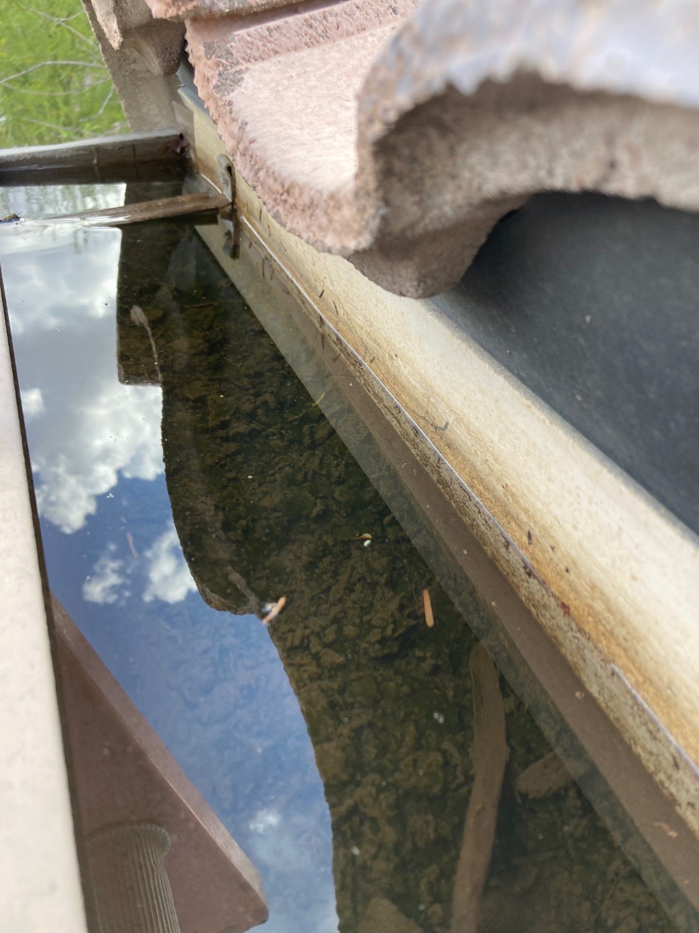 Commercial gutter cleaning Phoenix before photo with filled gutters