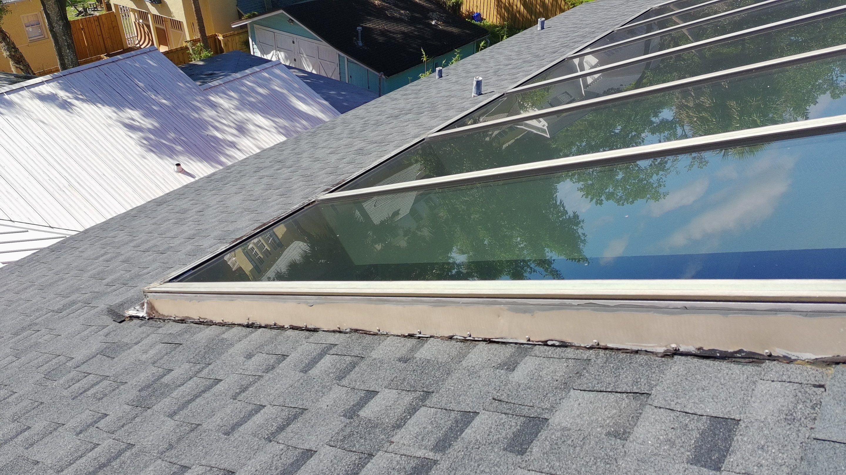 Ridge Skylight Repair and Shingle Roof Maintenance in Winter Park by Fortified Roofing Solutions Corp.