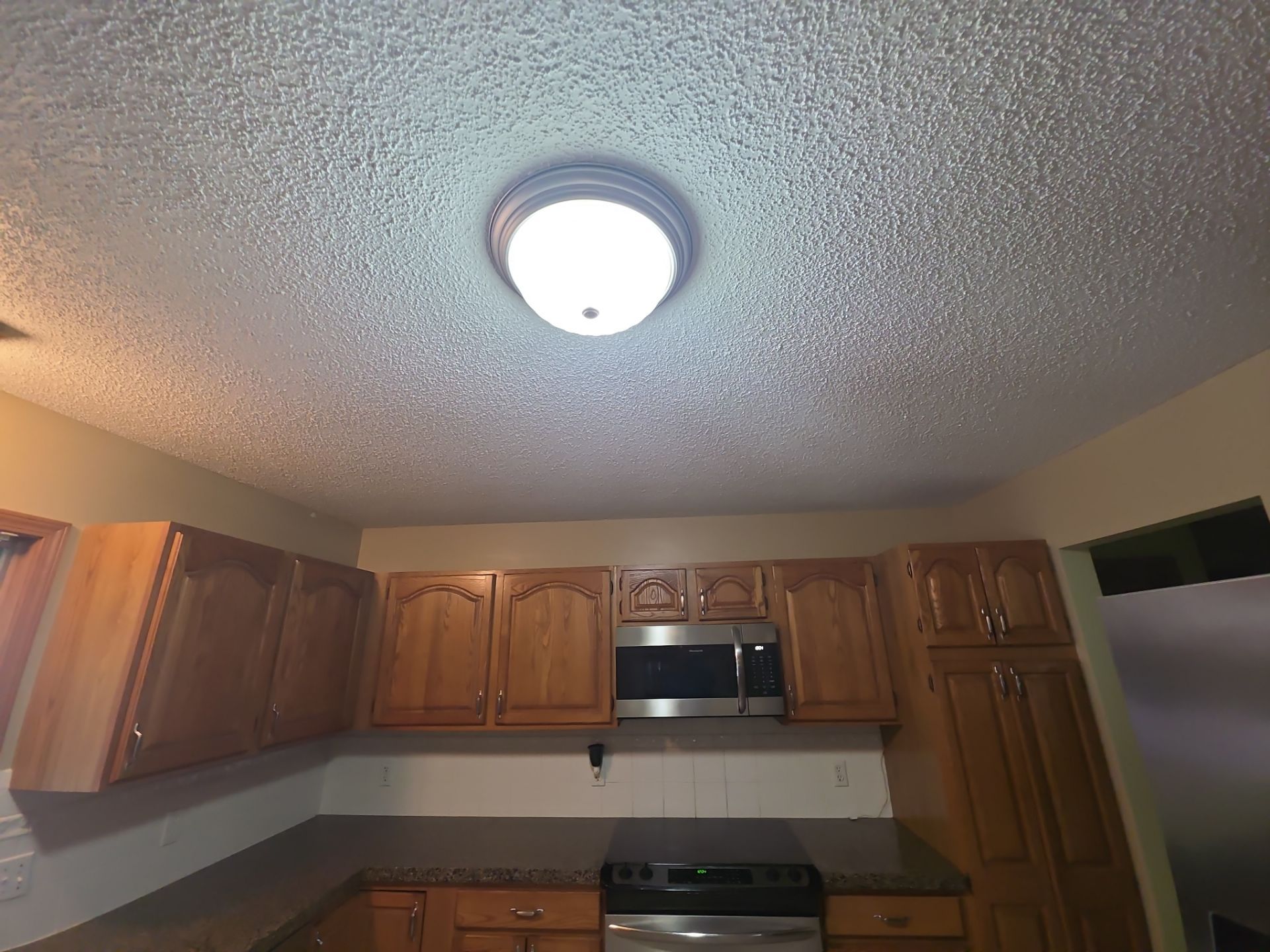 Norton Shores Kitchen Cabinet Painting and Deck Restoration Project by Gordon Painting