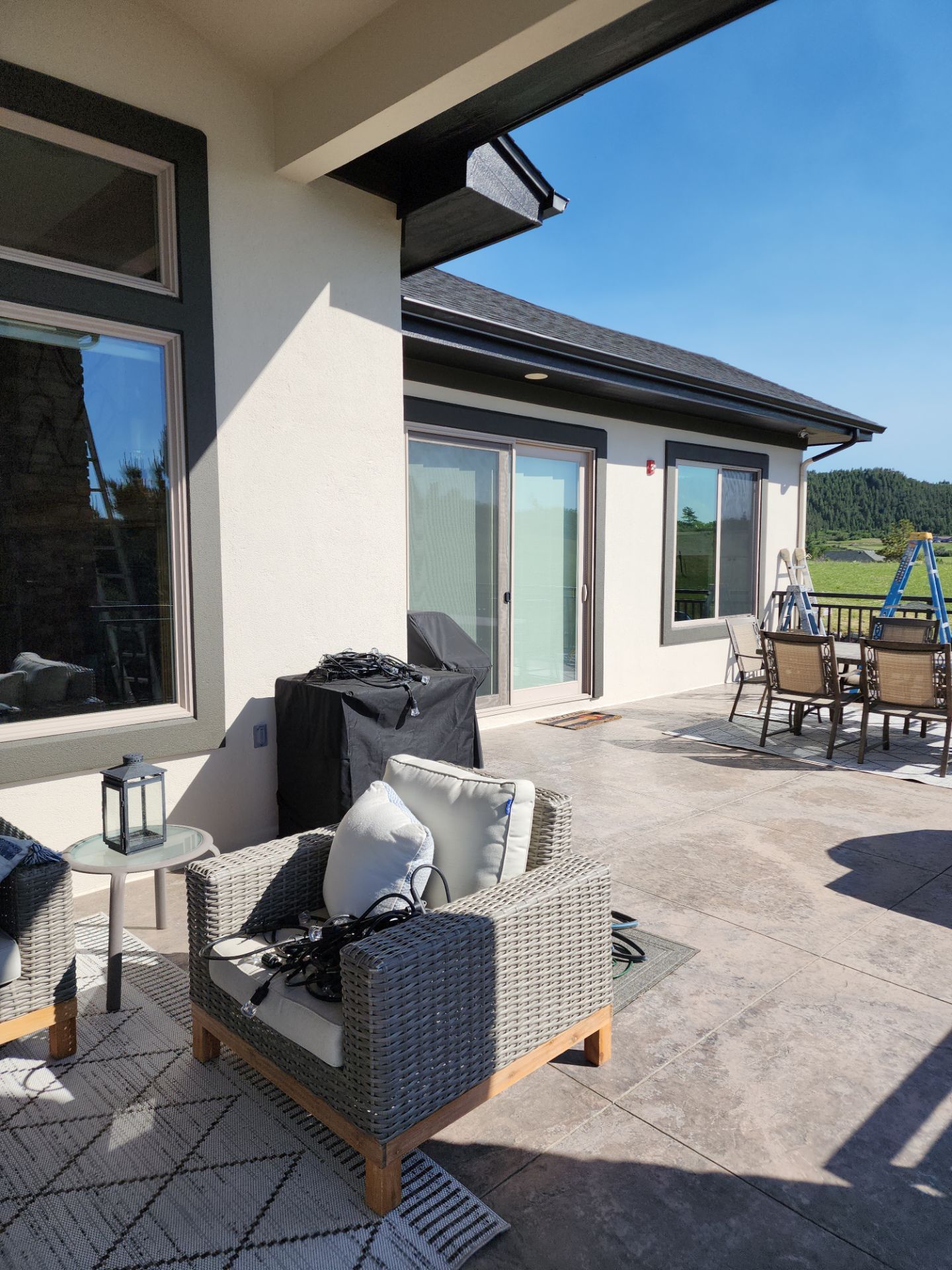 Castle Rock Elegance: White Stucco Exterior with Bold Tricorn Black by J&M Painting LLC