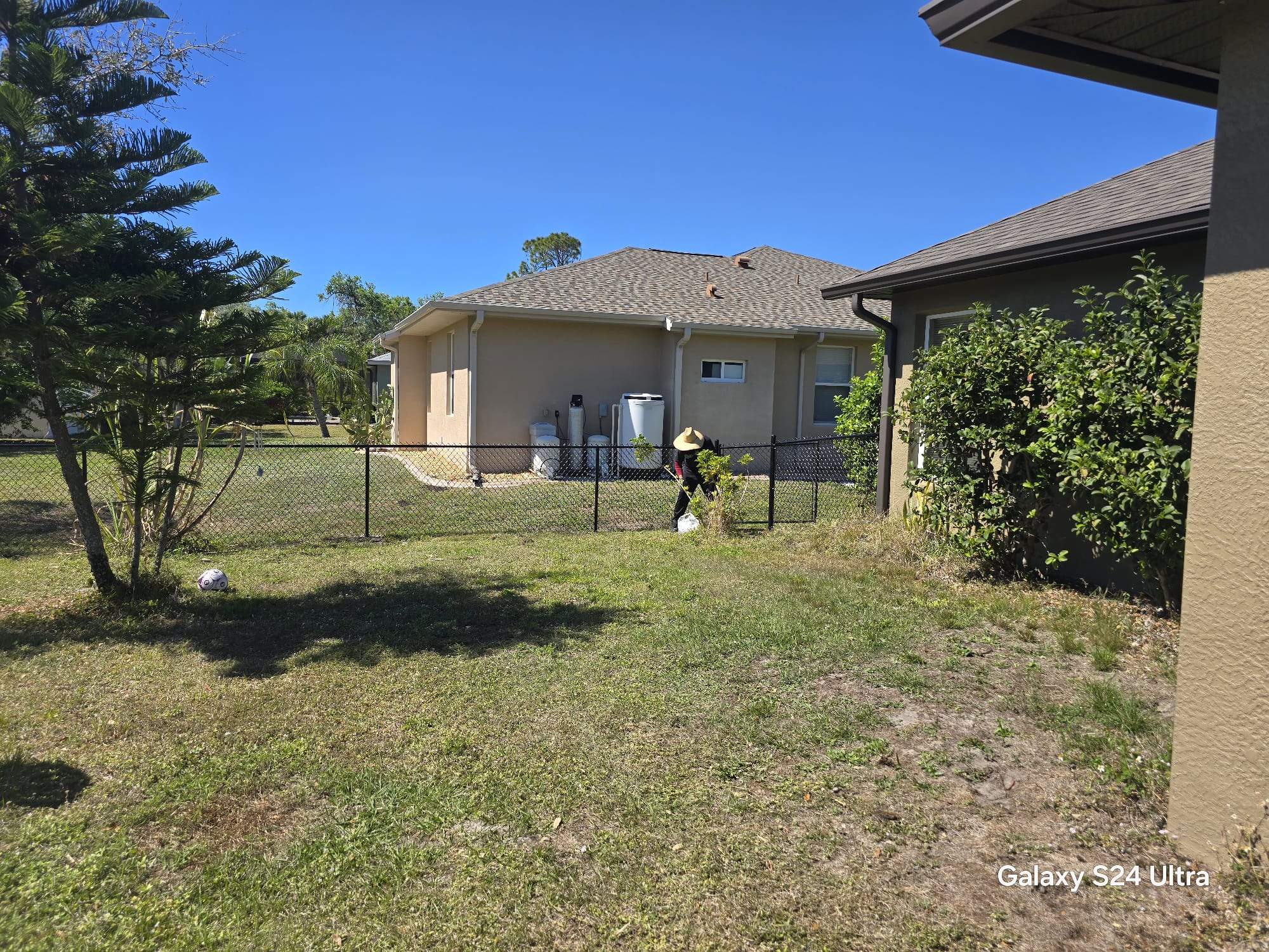Residential Black Vinyl-Coated Chain Link Fence Installation in North Port by True Fence LLC