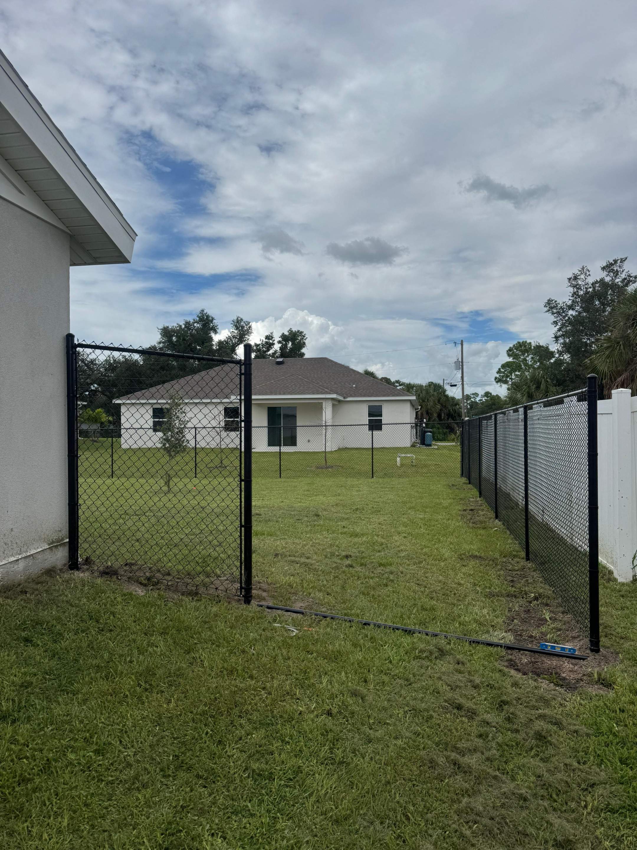 Residential Black Chain Link Fence Installation in North Port by True Fence LLC