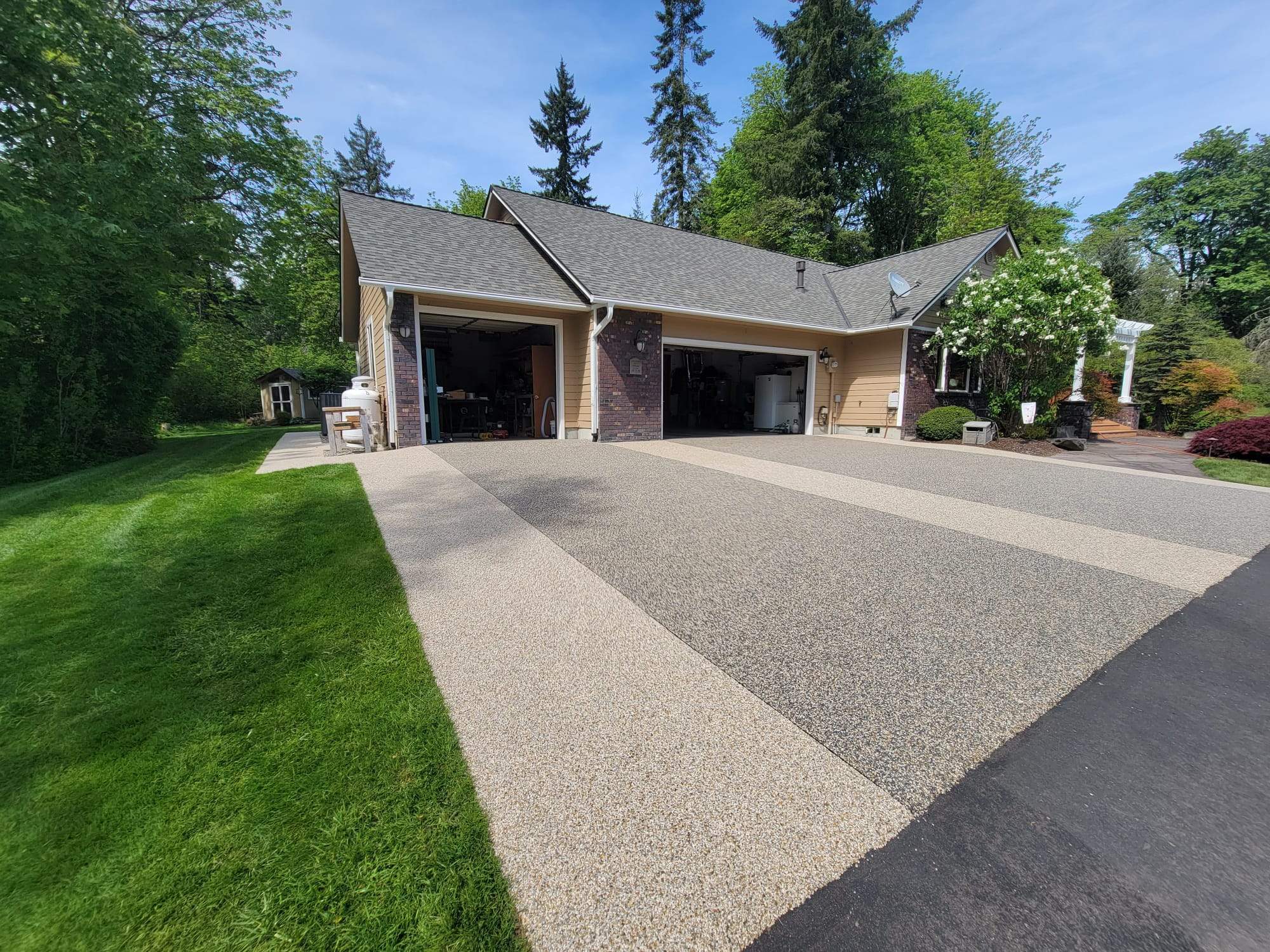 Luxury Driveway with Big Sur and Sistine Chapel Borders by Concrete Coating Experts Inc.