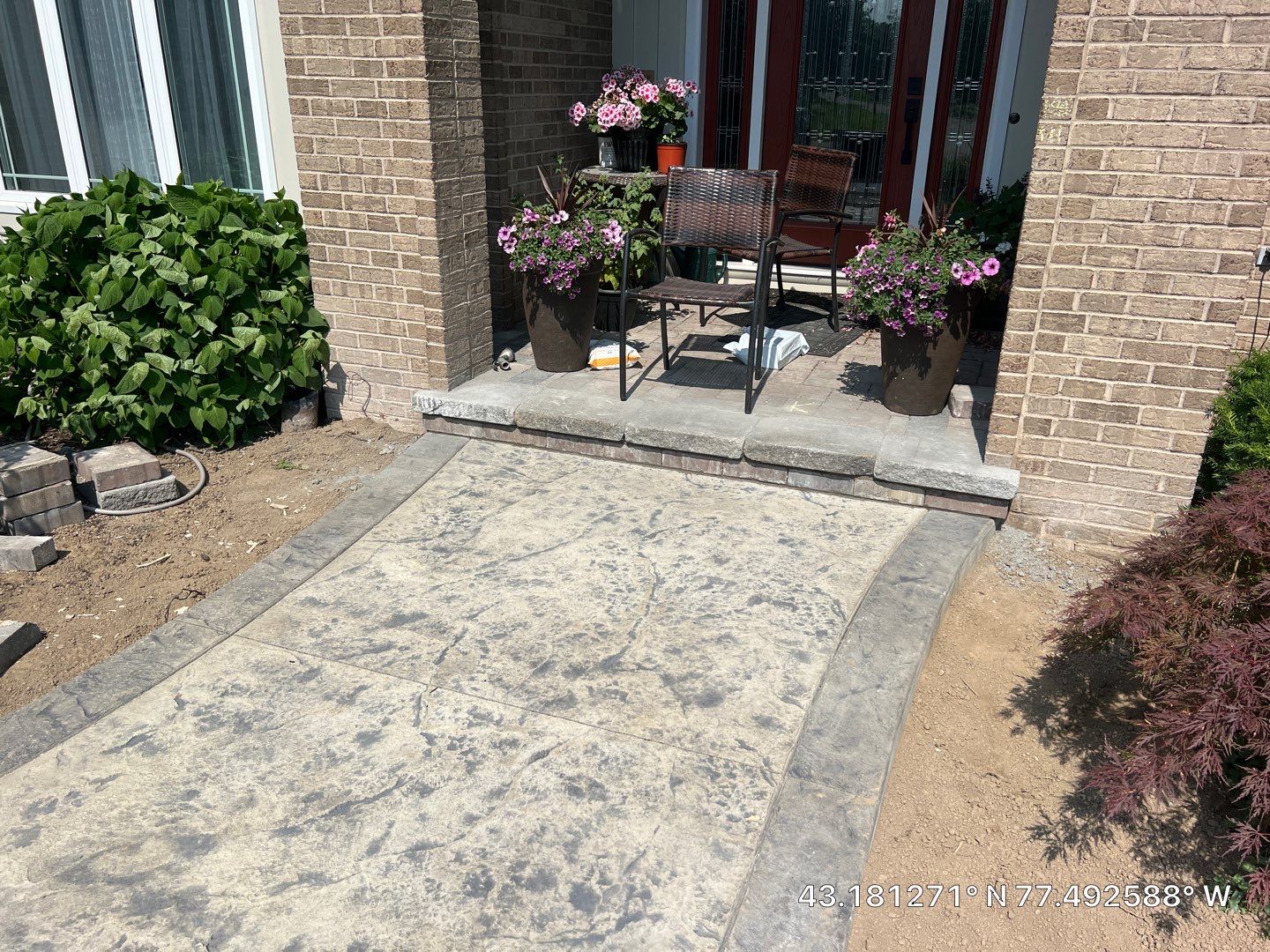 Heavy stone stamped concrete patio and sidewalk  by NG Masonry & Construction LLC
