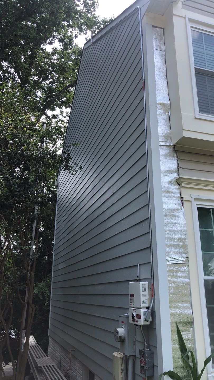 Exterior Home Makeover using GAF Timberline HDZ, GAF Decotech, and James Hardie Siding by American Home Contractors