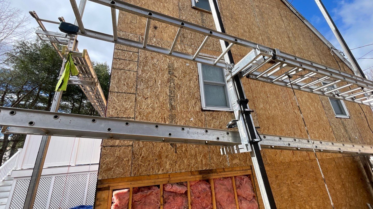 Complete Exterior Renovation with New Siding & Gutters   by Sensible Home Solutions