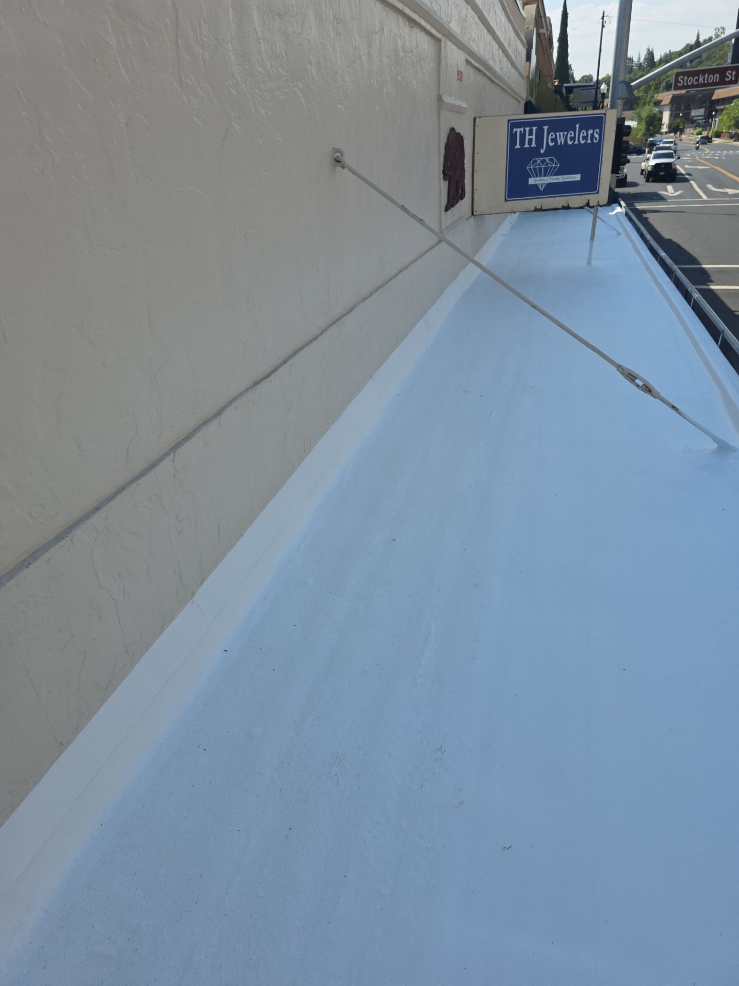 Foam and coatings on commercial roof by Straight Edge Roofing Inc
