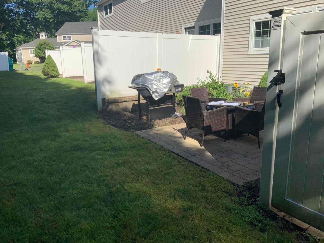 Vinyl privacy fence and matching gate  by DiGiorgi Roofing and Siding Inc