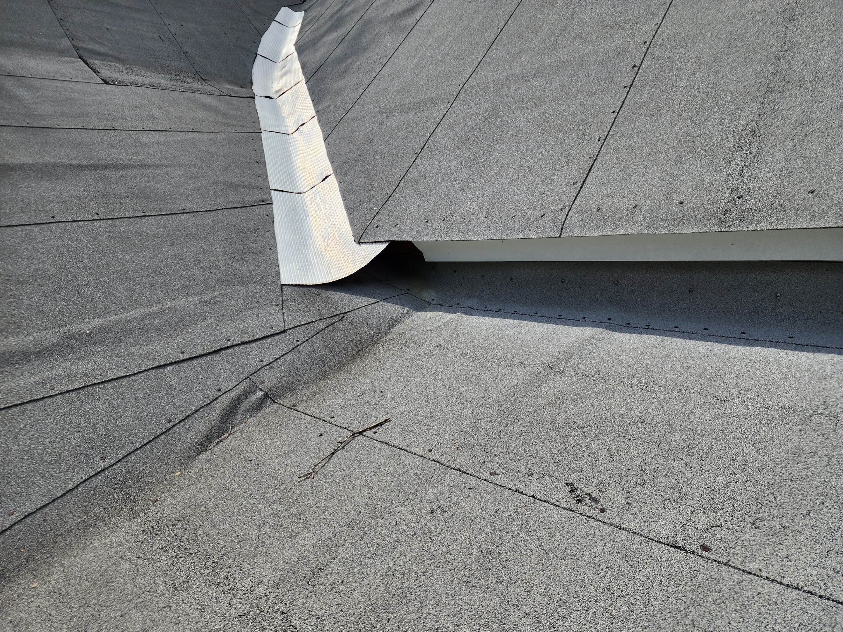 Residential Roofing Installation using 26 Gauge Colored Panels by Hostetler Roofing