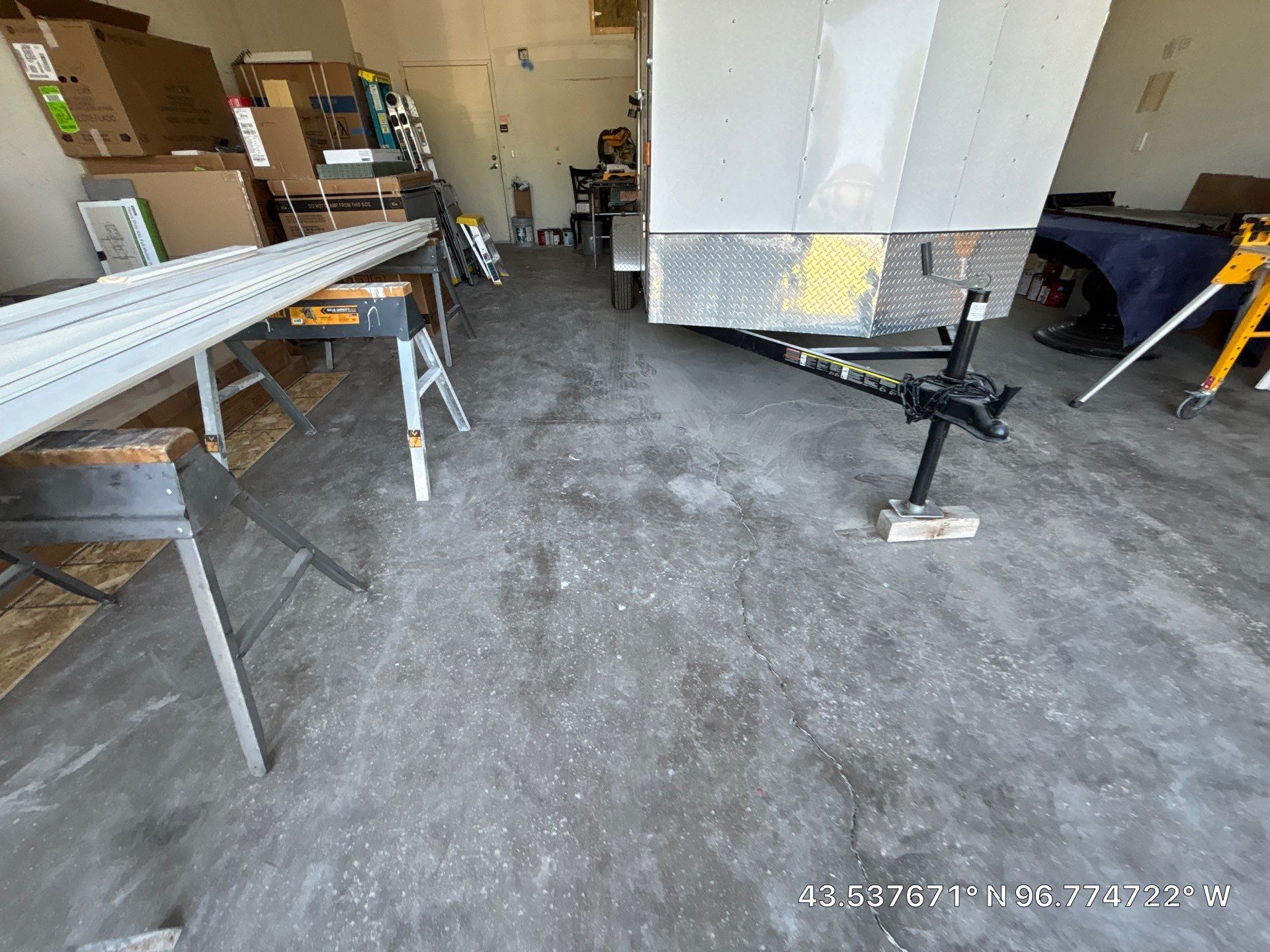 Coyote Flake Concrete Coating for Sioux Falls Garage by Select Painting, Coatings & Garage Cabinets