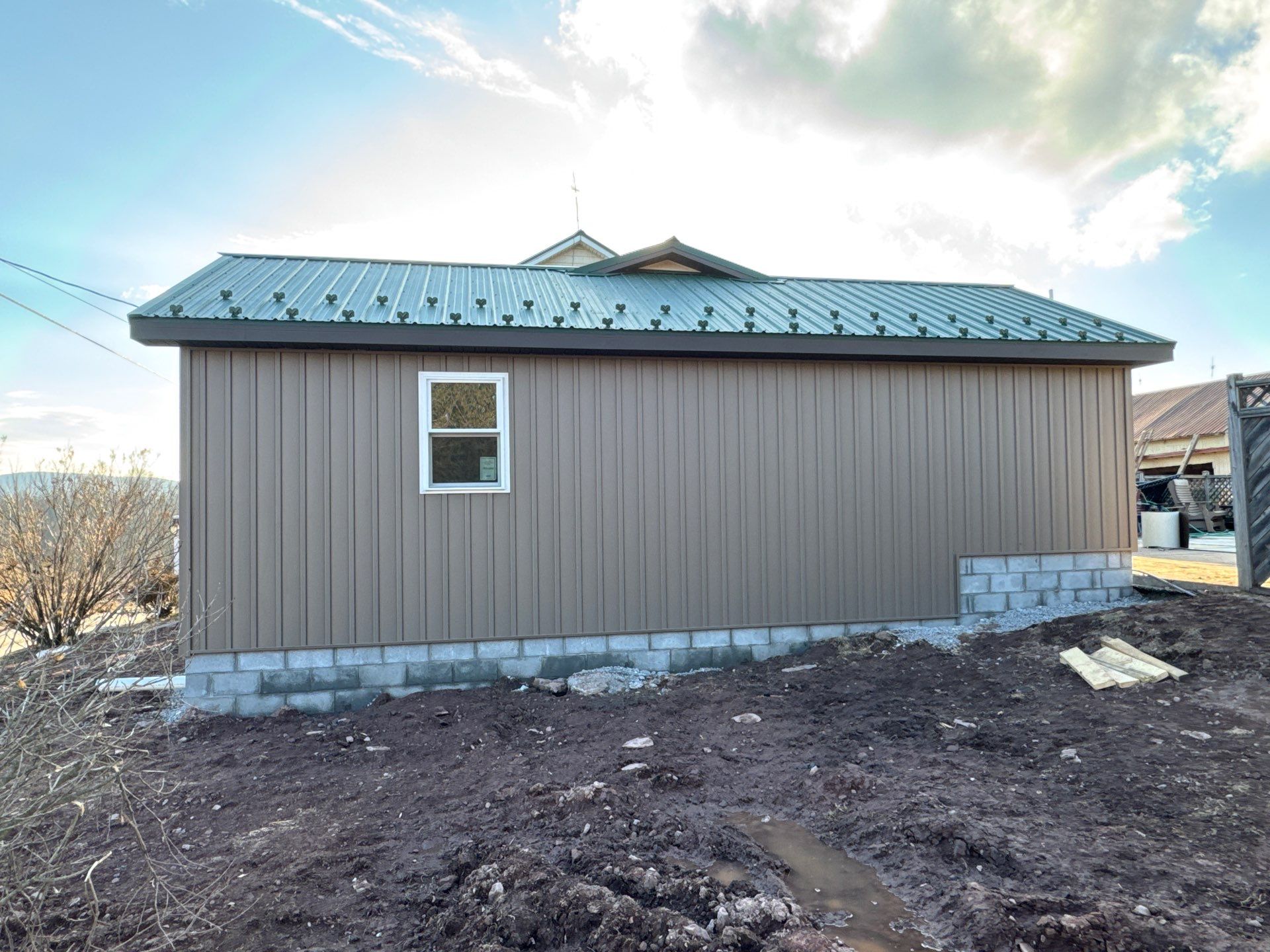 Multi-Story Residential Addition Featuring Textured Metal Siding in Millersburg by Esh Builders