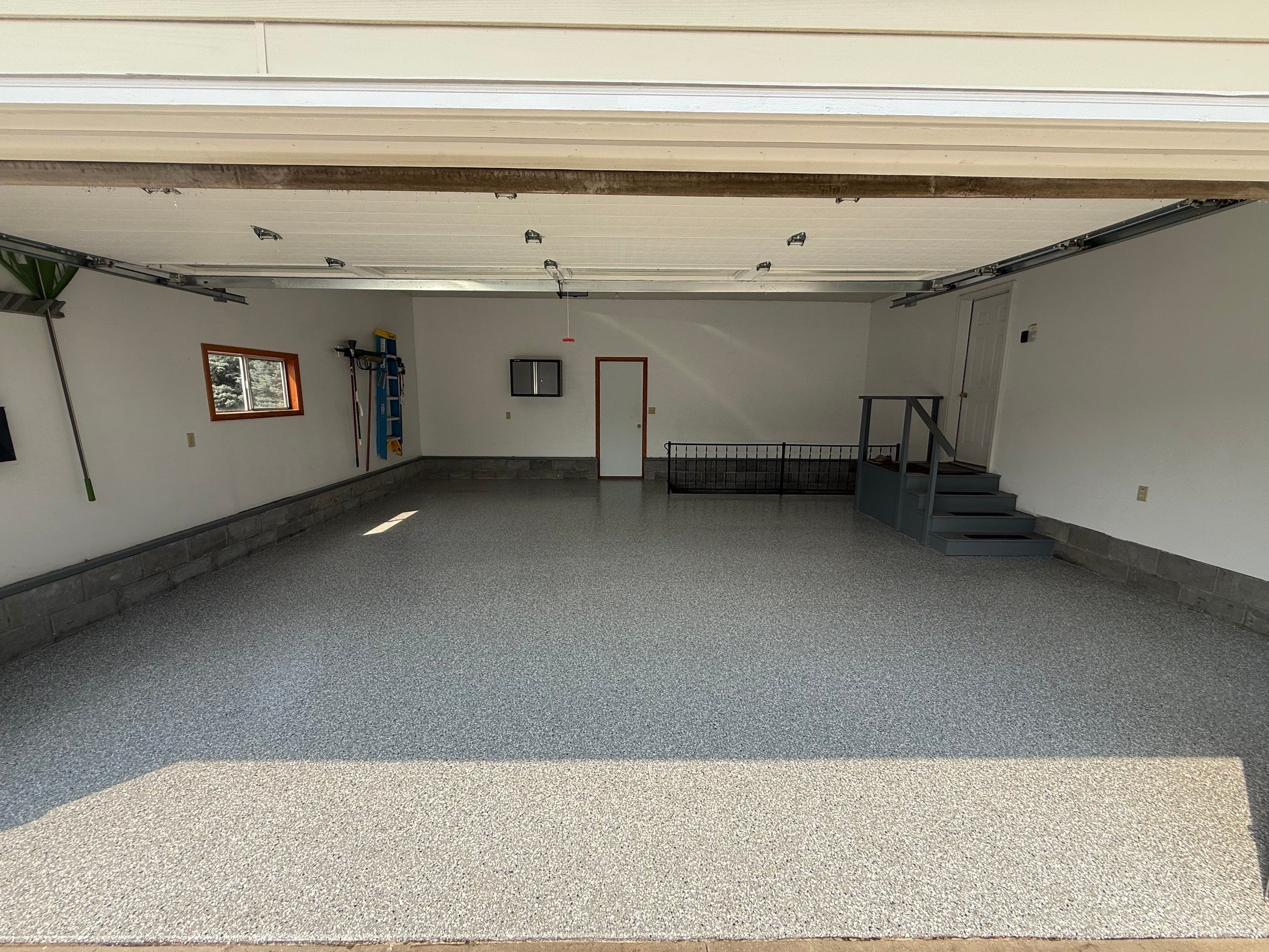 Feather Grey Garage Floor Coating and Concrete Restoration in Mitchell by Select Painting, Coatings & Garage Cabinets
