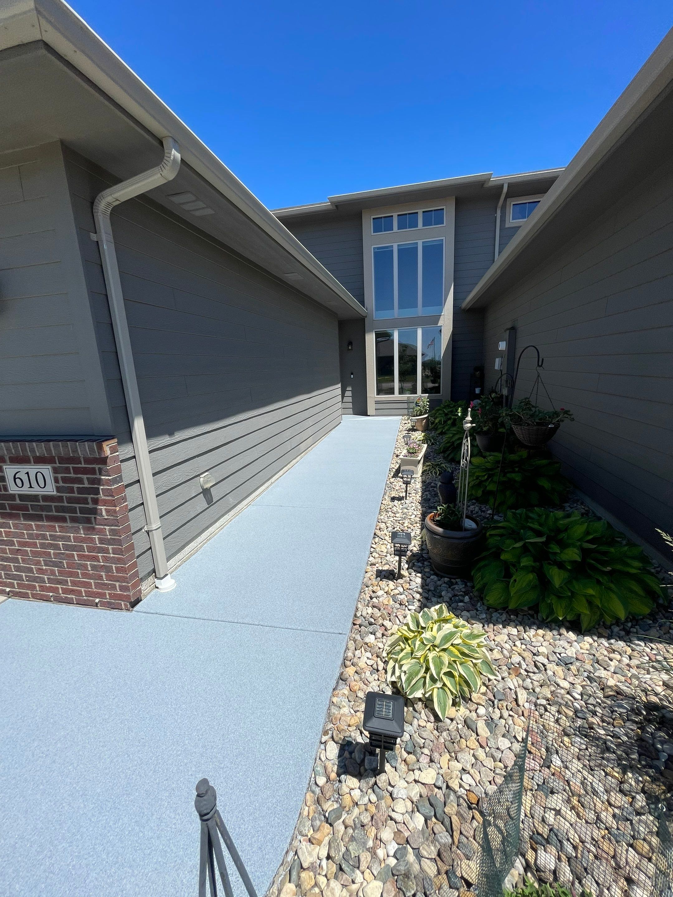 Custom Concrete Coating for Sioux Falls Patio and Front Walkway by Select Painting, Coatings & Garage Cabinets