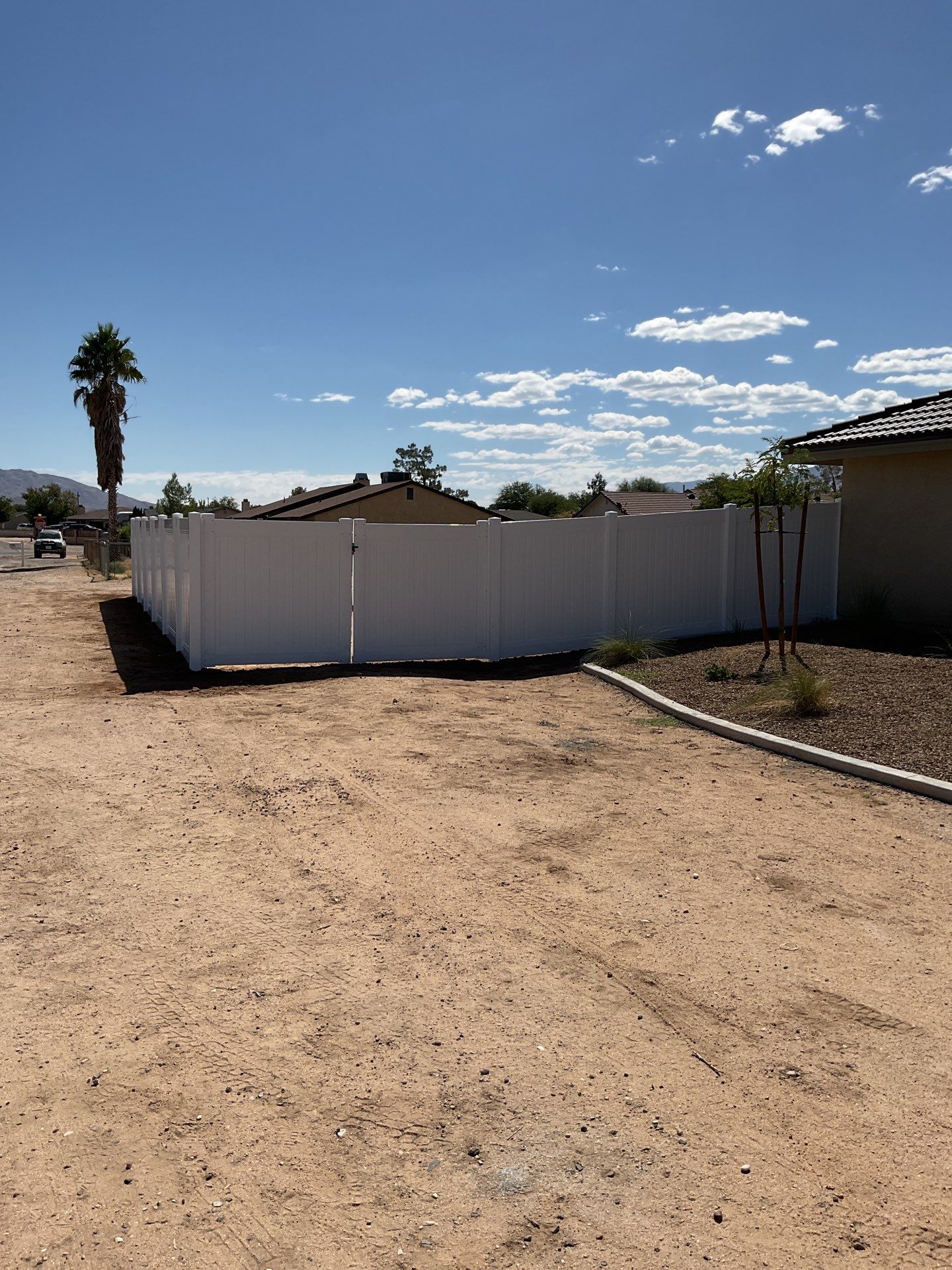 6ft White Privacy Vinyl Fence with Chain-link Fence by Fence Guys Inc.