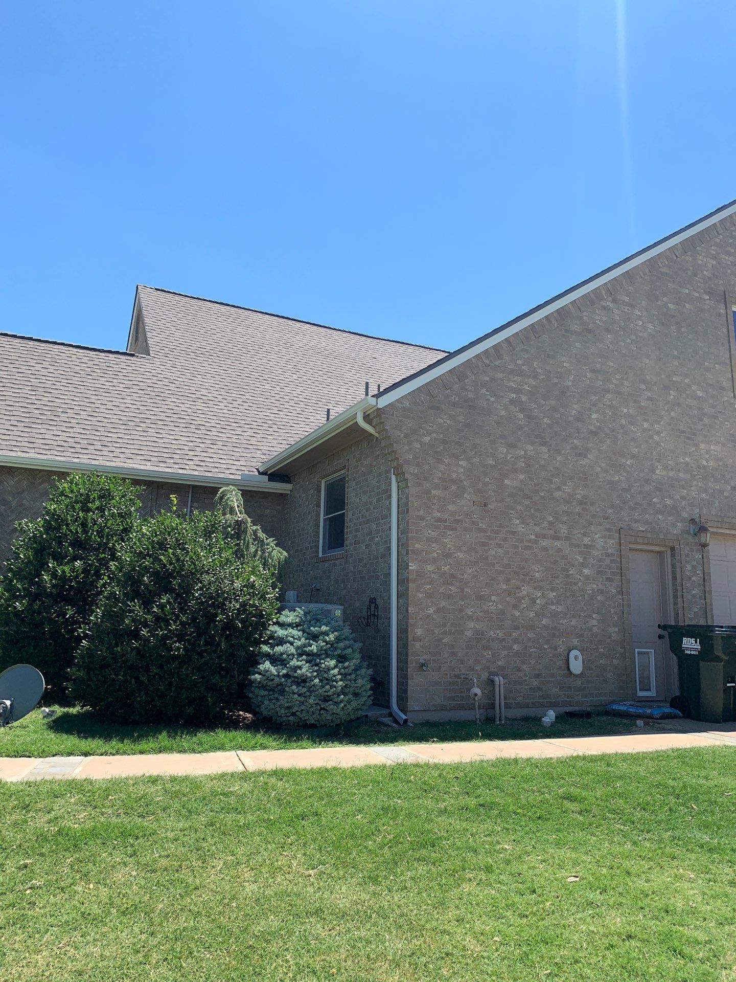 Roof Replacement and Gutter Installation in Edmond, OK by McCann's Roofing and Construction