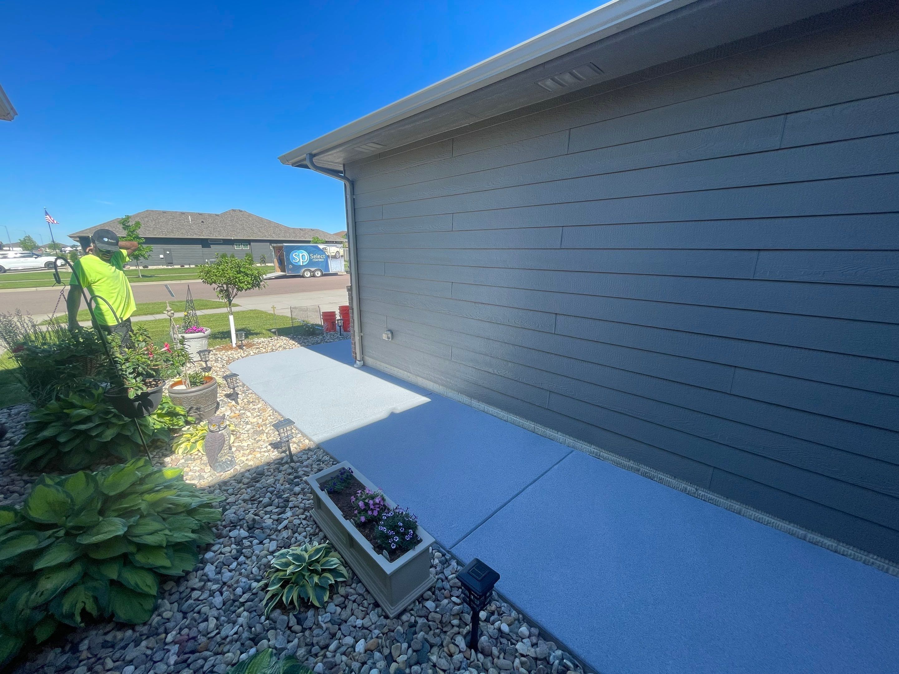 Custom Concrete Coating for Sioux Falls Patio and Front Walkway by Select Painting, Coatings & Garage Cabinets