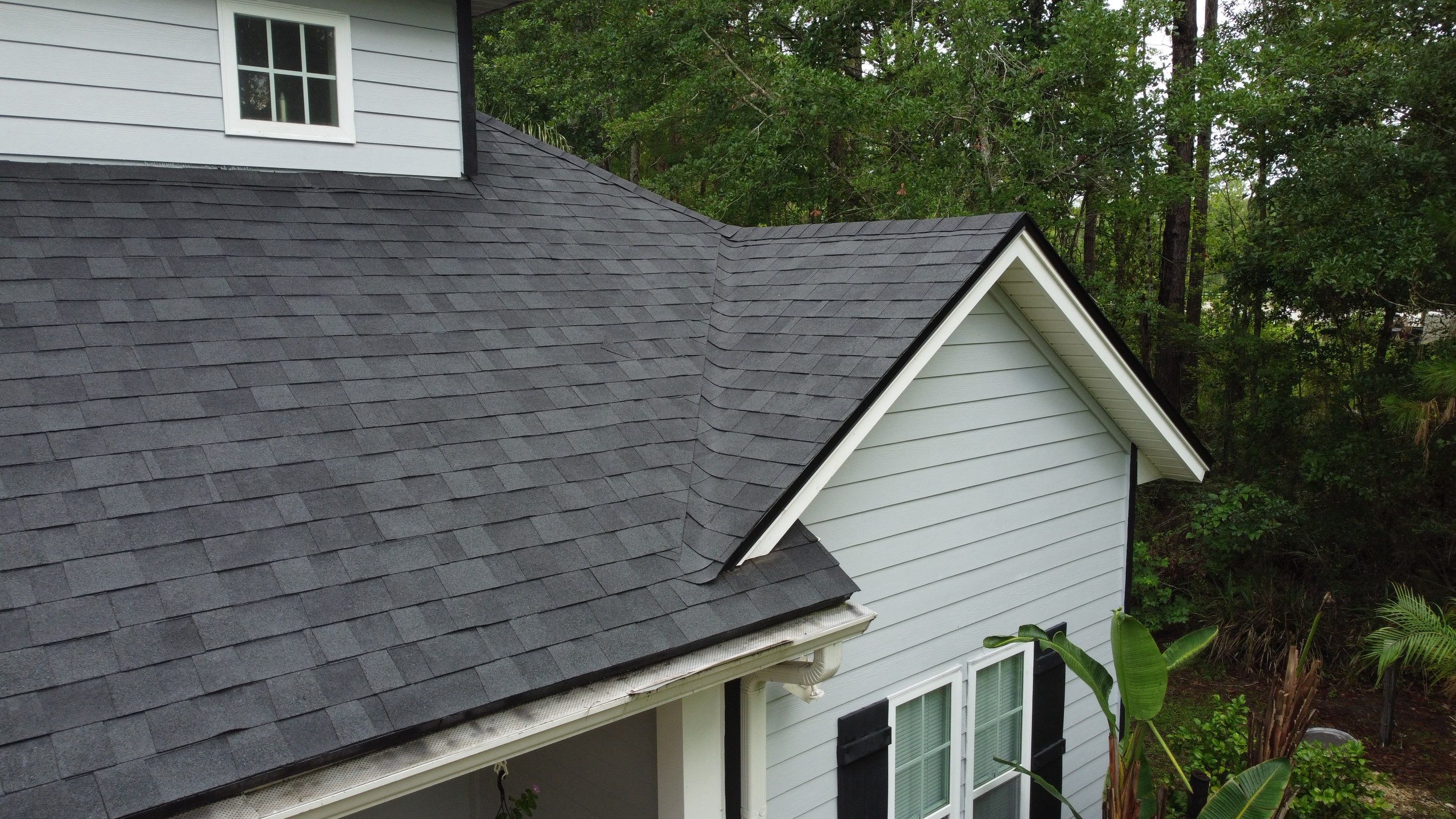 Complete Onyx Black Asphalt Shingle Roof Replacement and Skylight Installation in Jacksonville by Trinity Restoration and Roofing LLC
