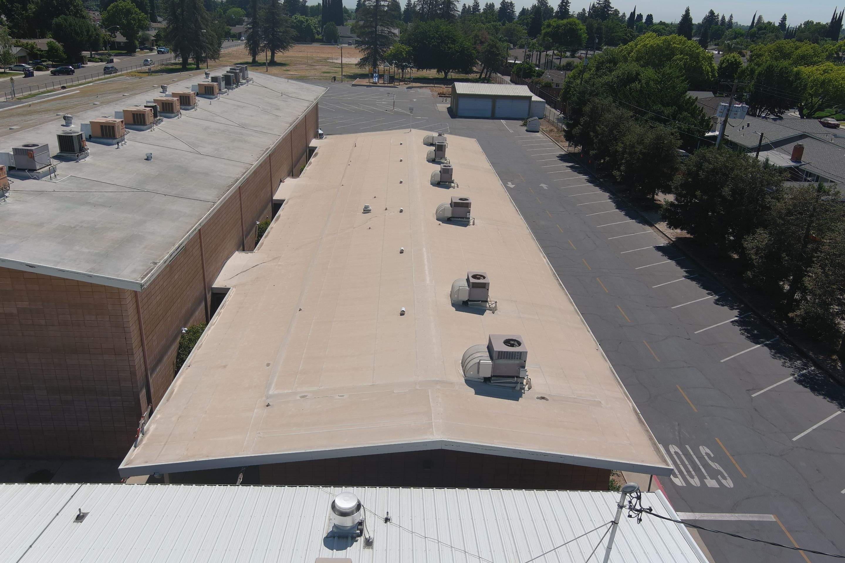 MR Roofing system using Benchmark/PUMA XL coatings over TPO single-ply roofing by Straight Edge Roofing Inc
