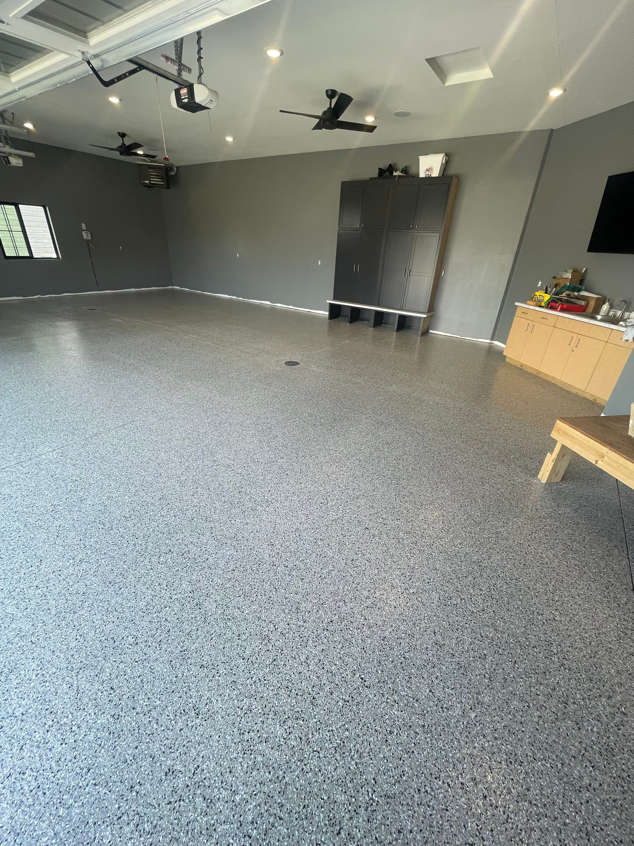 Custom Speckled Concrete Coating for Dell Rapids Garage by Select Painting, Coatings & Garage Cabinets