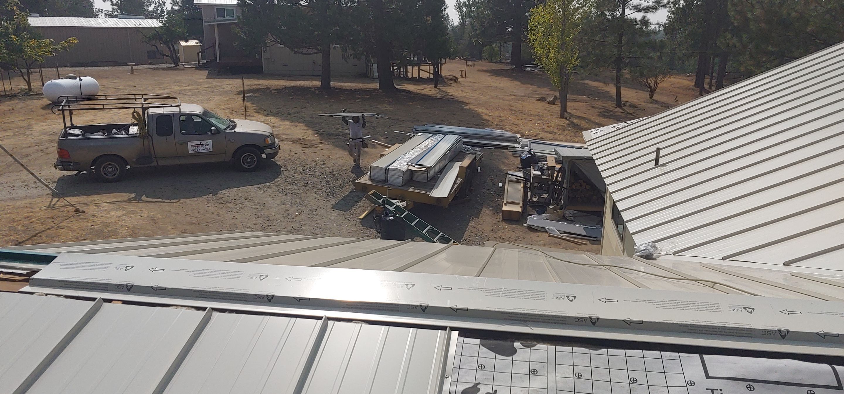 Residential Roofing Installation using Standing seam metal roofing system by Straight Edge Roofing Inc