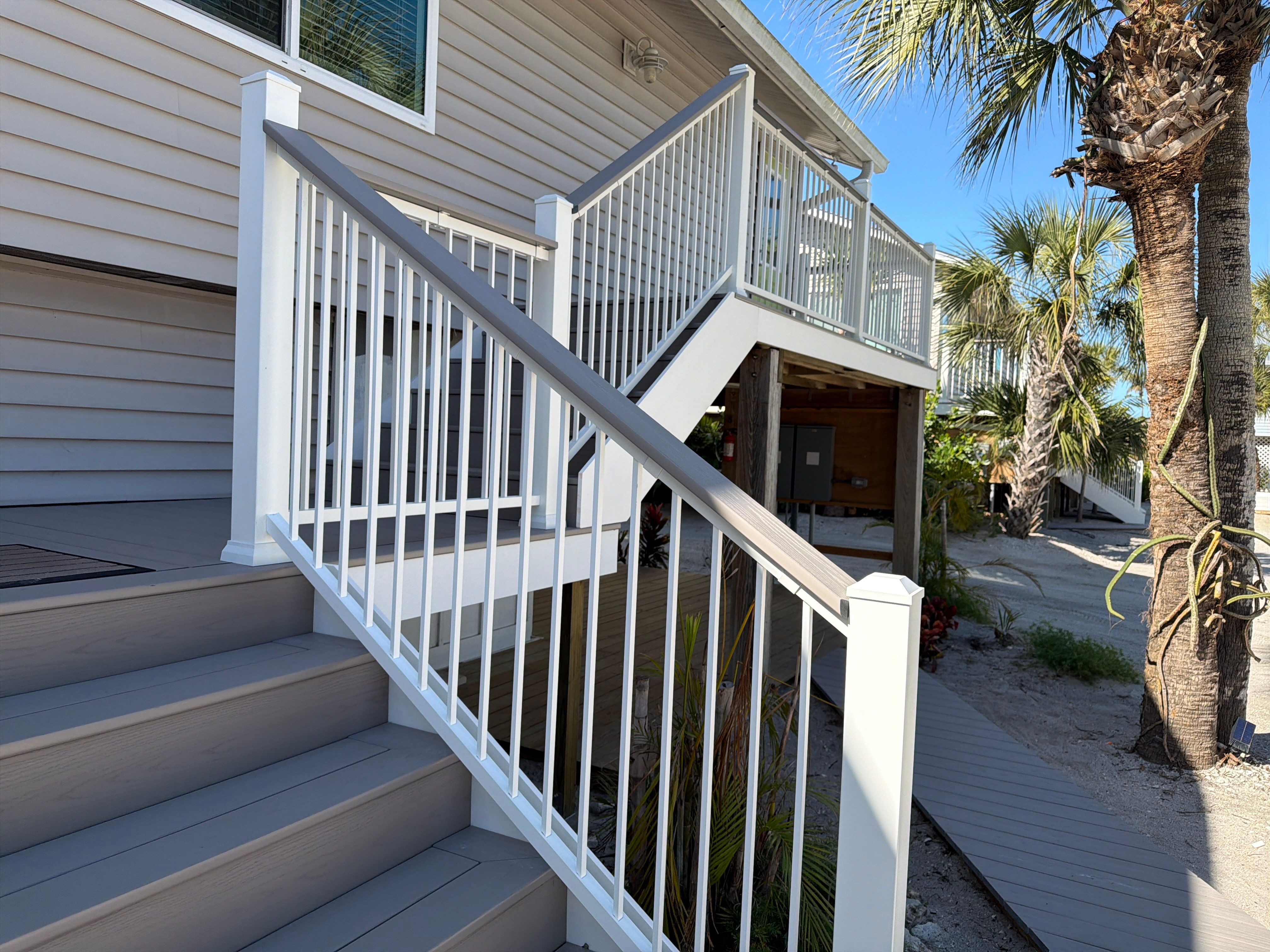 Elevated Coastal Home Renovation with Siding and Custom Decks in Englewood by Smirnov Construction Inc