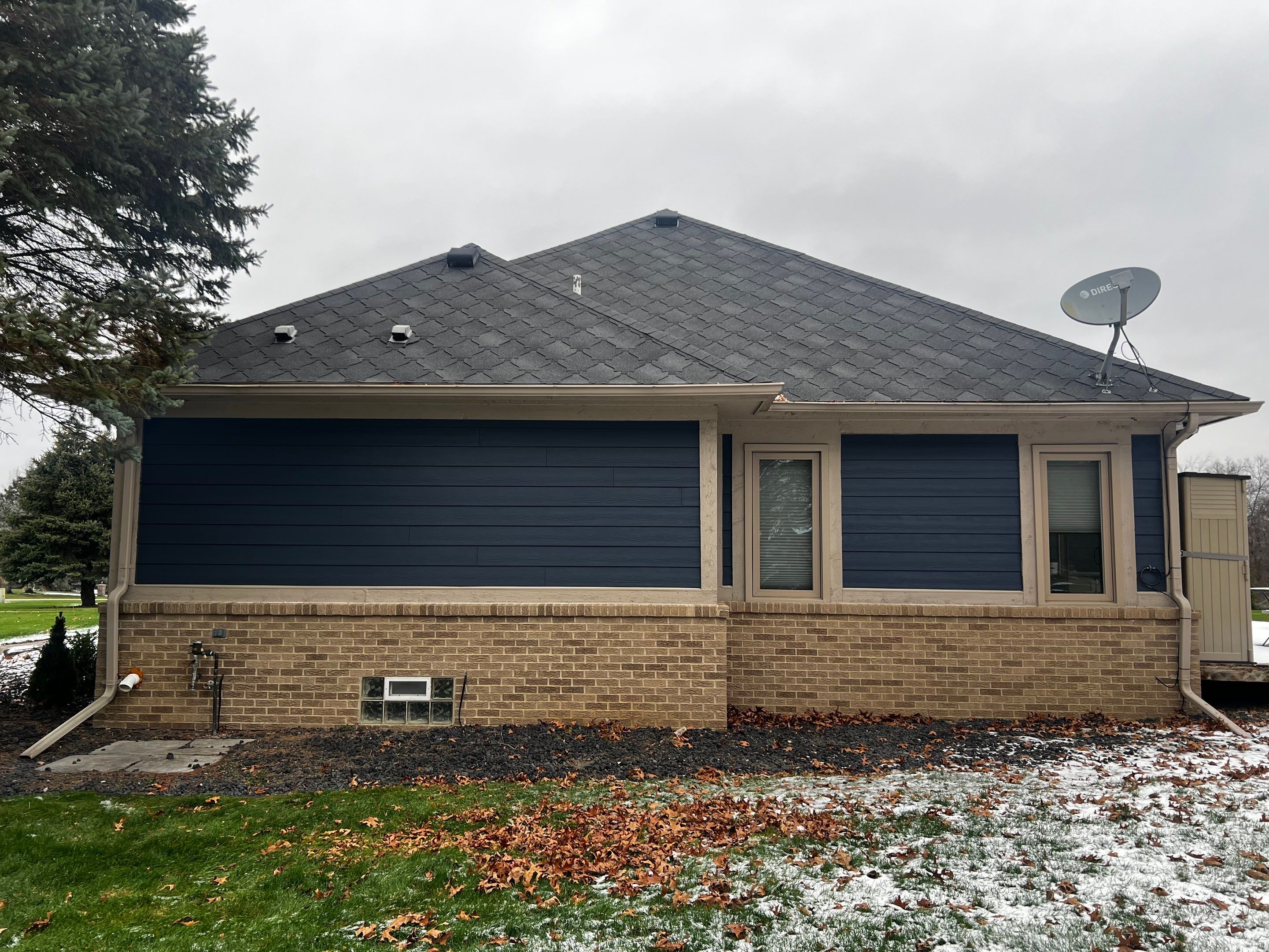Siding Replacement using James HardiePlank Cedarmill in Deep Ocean color by Bloomfield Construction & Restoration