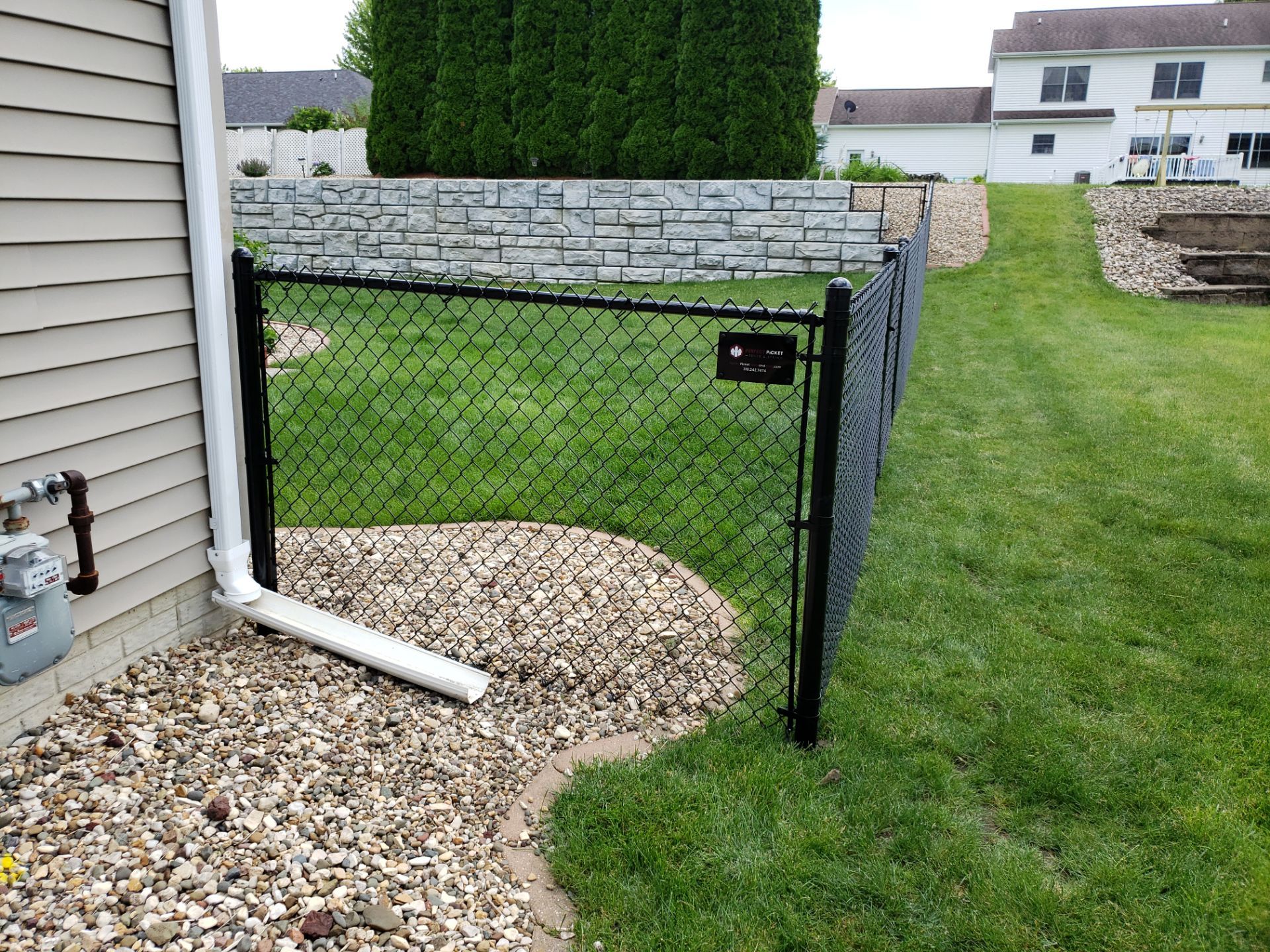 Black Vinyl-Coated Chain Link Fence Installation in Denver by Perfect Picket Fence and Stain