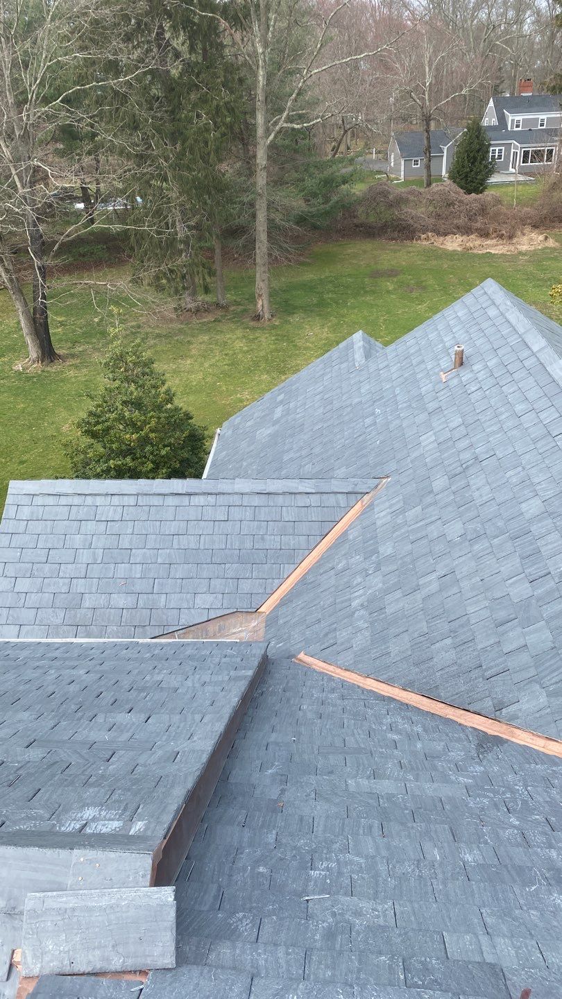 Residential Roofing Installation using Vermont Slate by A Plus Exterior