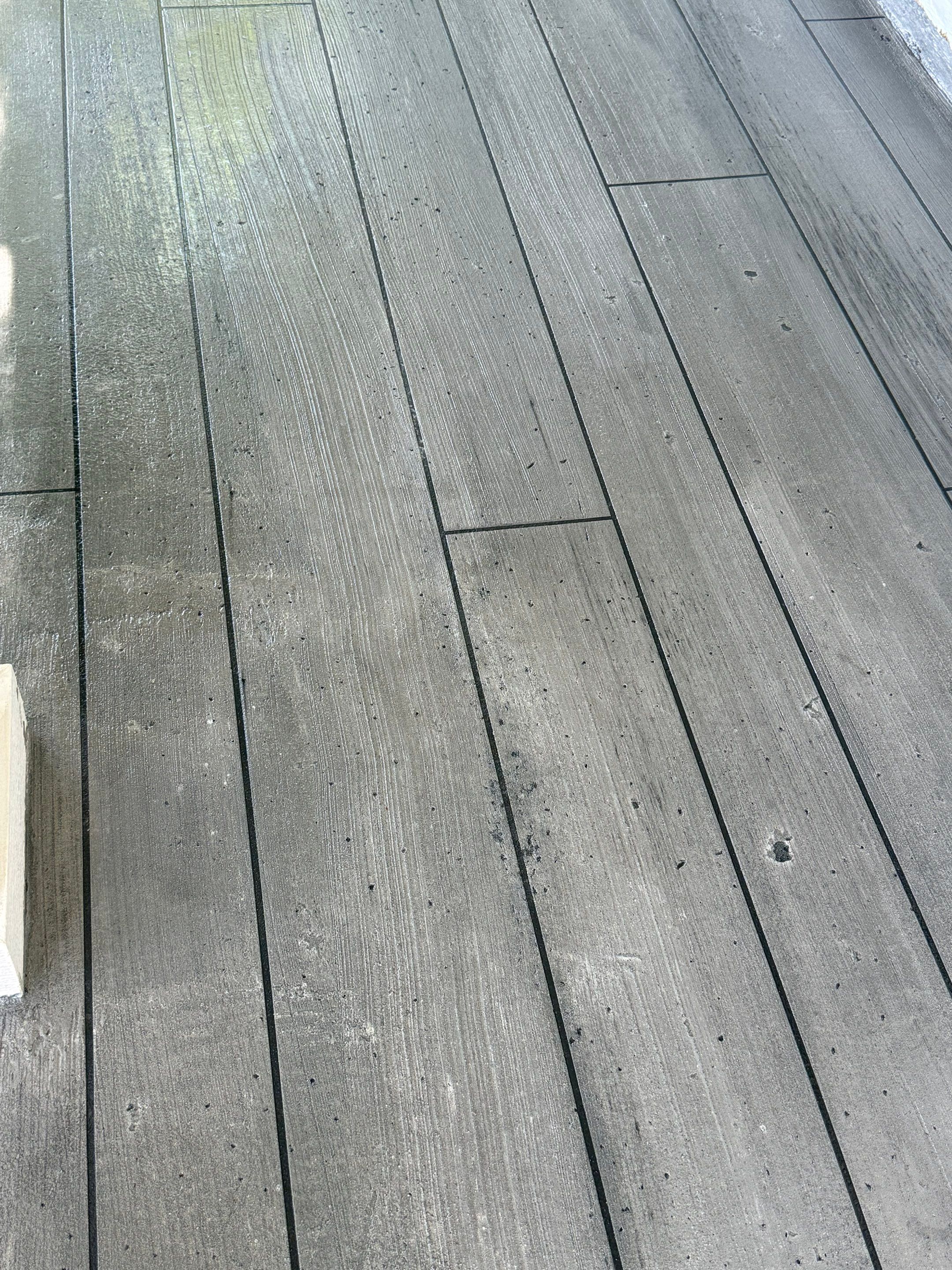 Wood-Grain Stenciled Concrete Porch Resurfacing in Mobile by Cornerstone Hard Surface Restoration 